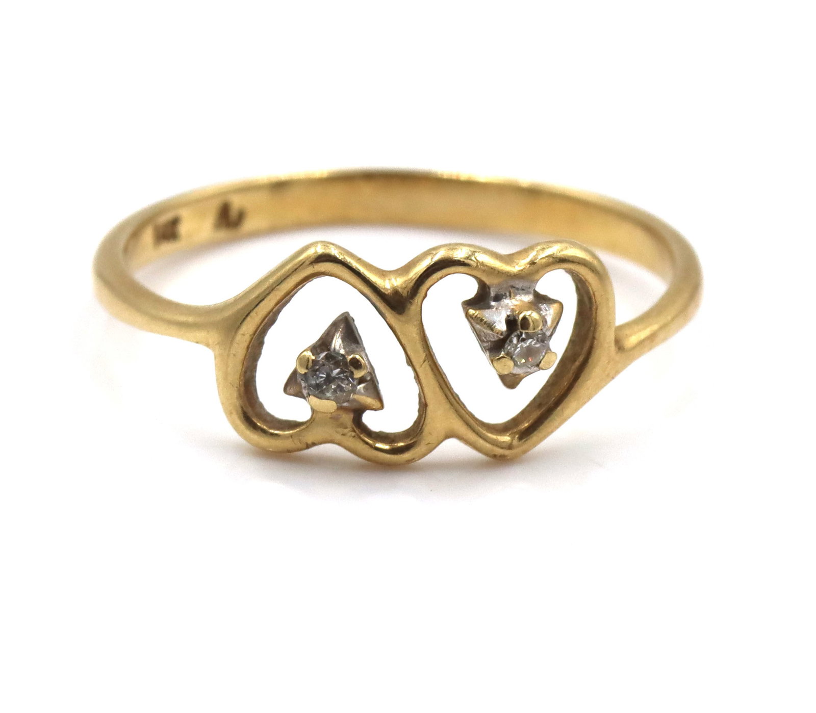 14kt Yellow gold 2 heart shaped ring with diamond accents: 14kt Yellow gold 2 heart shaped ring with diamond accents. The total weight of the ring is 1.3 grams. Ring size 6".
