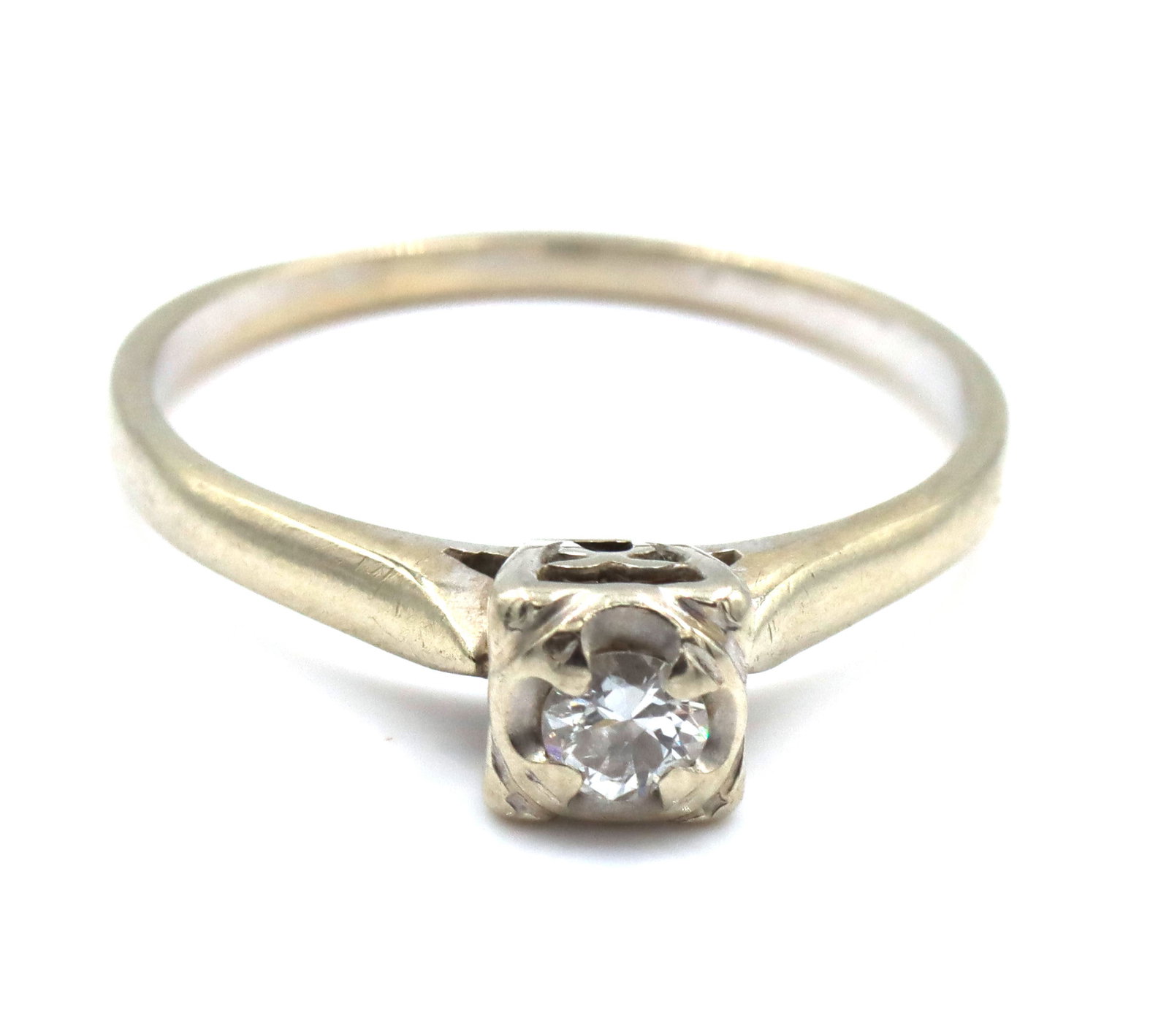 14kt White gold round diamond engagement ring: 14kt White gold round diamond engagement ring. The total weight of the ring is 2.1 grams. Ring size 8".