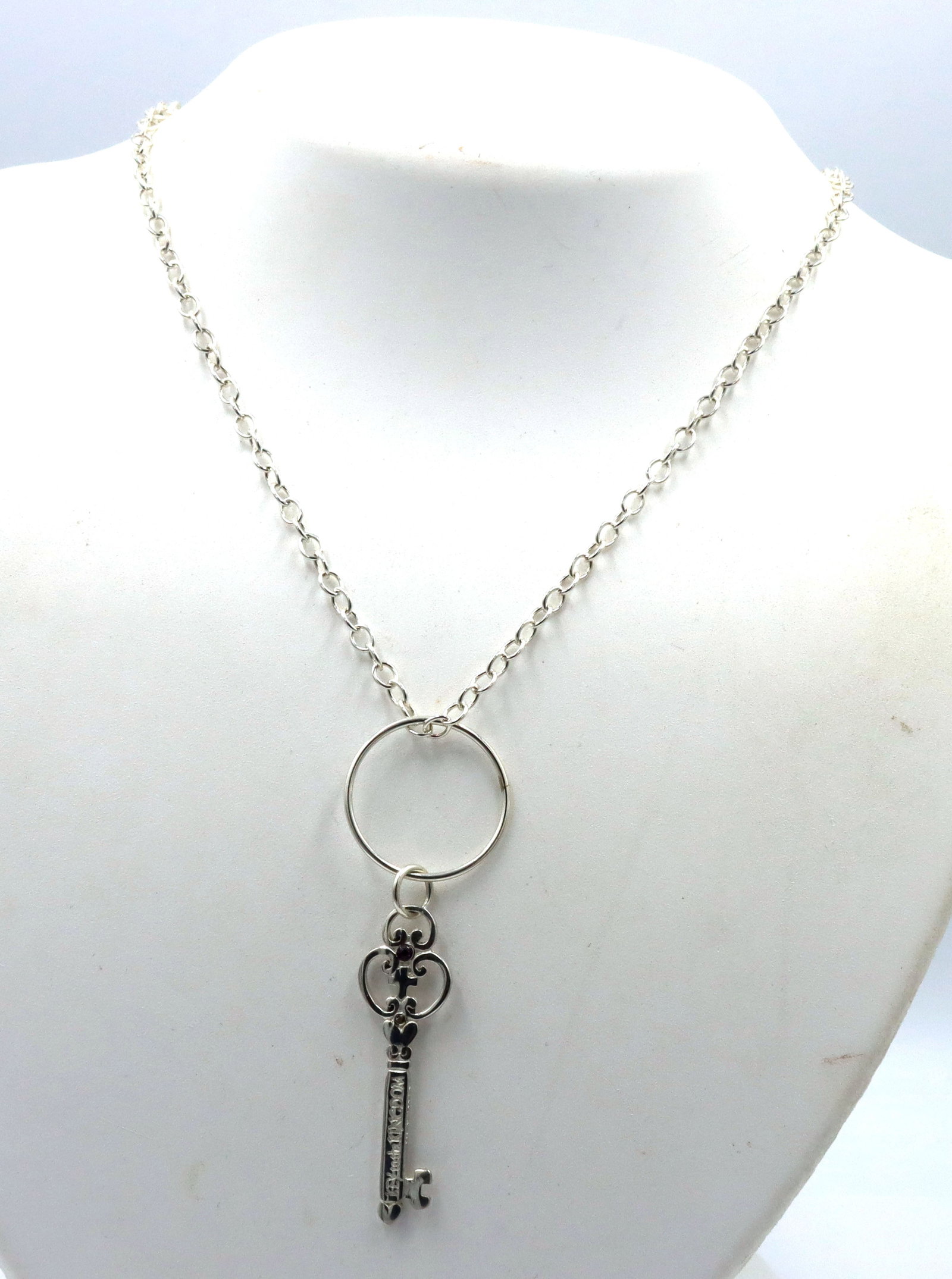 925 Sterling silver Key on Kingdom pendant on chain: 925 Sterling silver Key on Kingdom pendant on 20-inch chain necklace with lobster clasp. The total weight of the necklace is 9.6 grams.