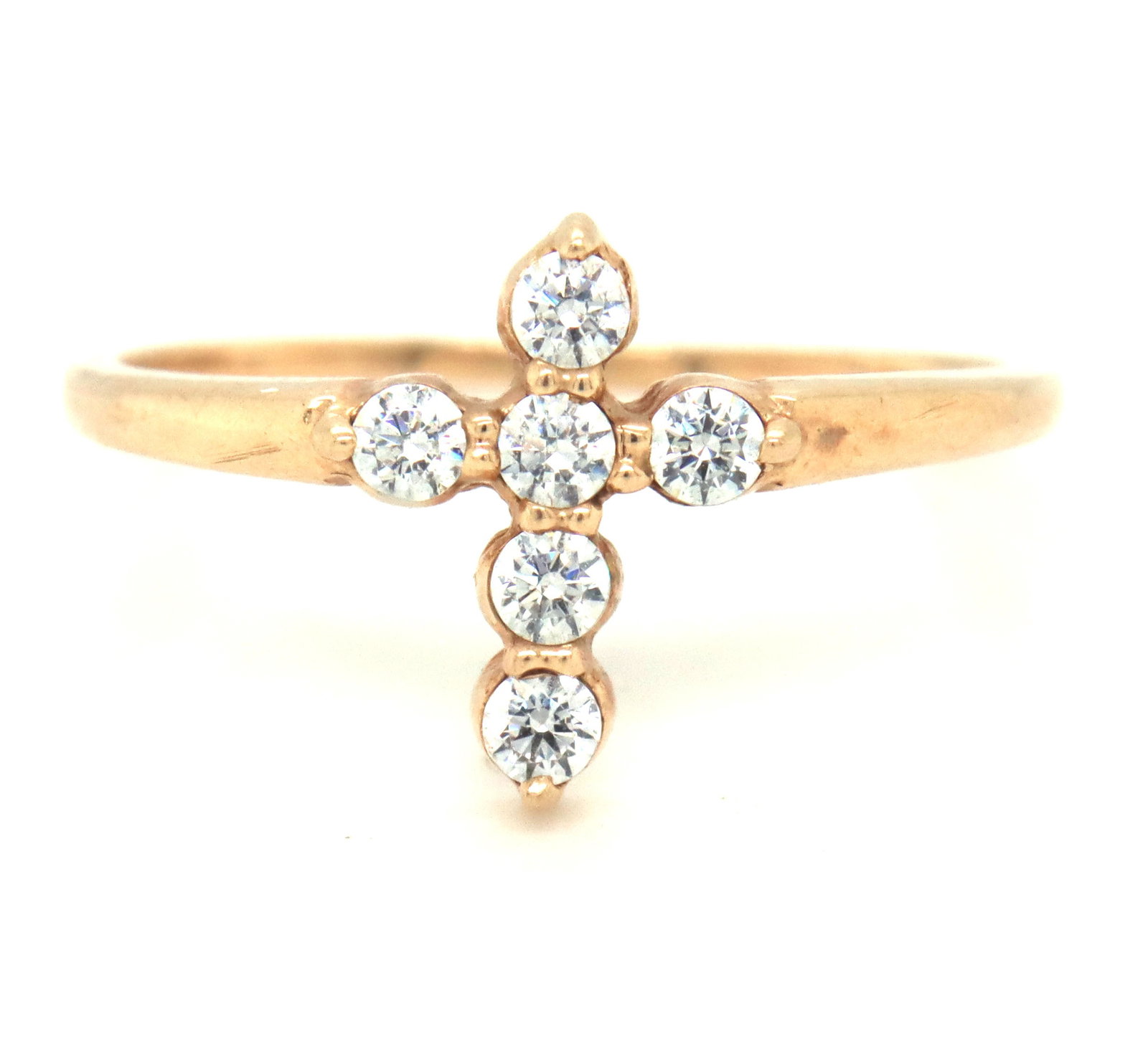10kt Yellow gold cubic zirconia cross ring: 10kt Yellow gold cubic zirconia cross ring. The total weight of the ring is 1.5 grams. Ring size 8".