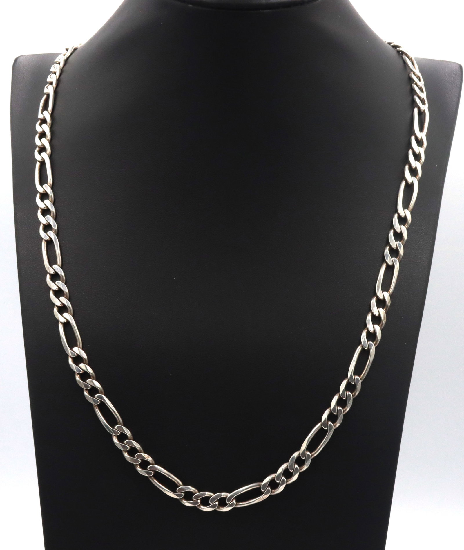 Italian 925 sterling silver Figaro chain necklace: Italian 925 sterling silver Figaro 24-inch chain necklace with lobster clasp. The total weight of the chain is 38.70 grams.