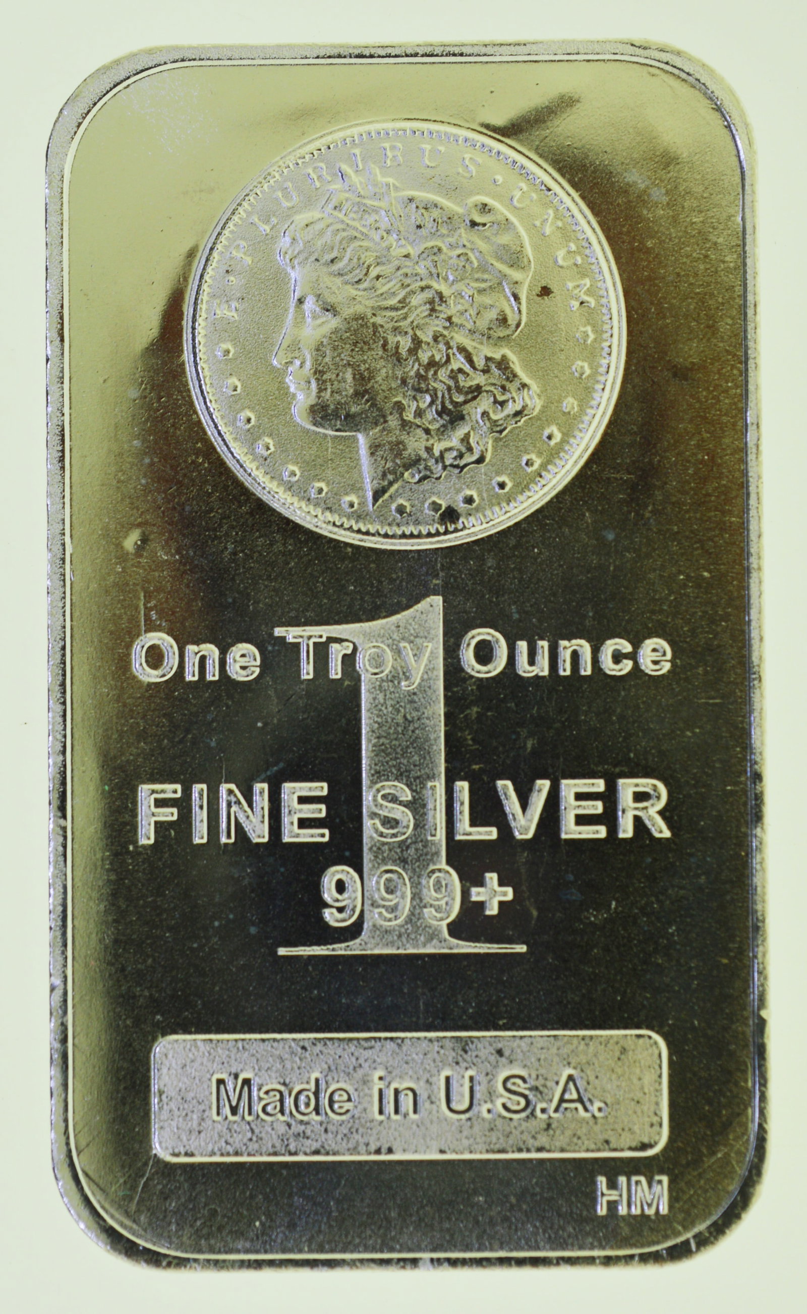 Morgan Silver Dollar Design ? 1 oz .999 Fine Silver Bar: This 1 troy ounce silver bar features the iconic Morgan Silver Dollar?inspired design, a classic favorite among silver investors and collectors. Struck in .999 fine silver, this bar offers both intrin