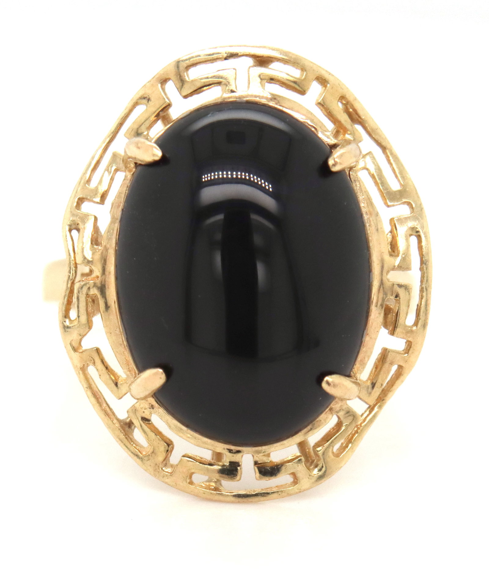 14kt Yellow gold oval black onyx ring: 14kt Yellow gold oval black onyx ring. The total weight of the ring is 3.6 grams. Ring size 7".