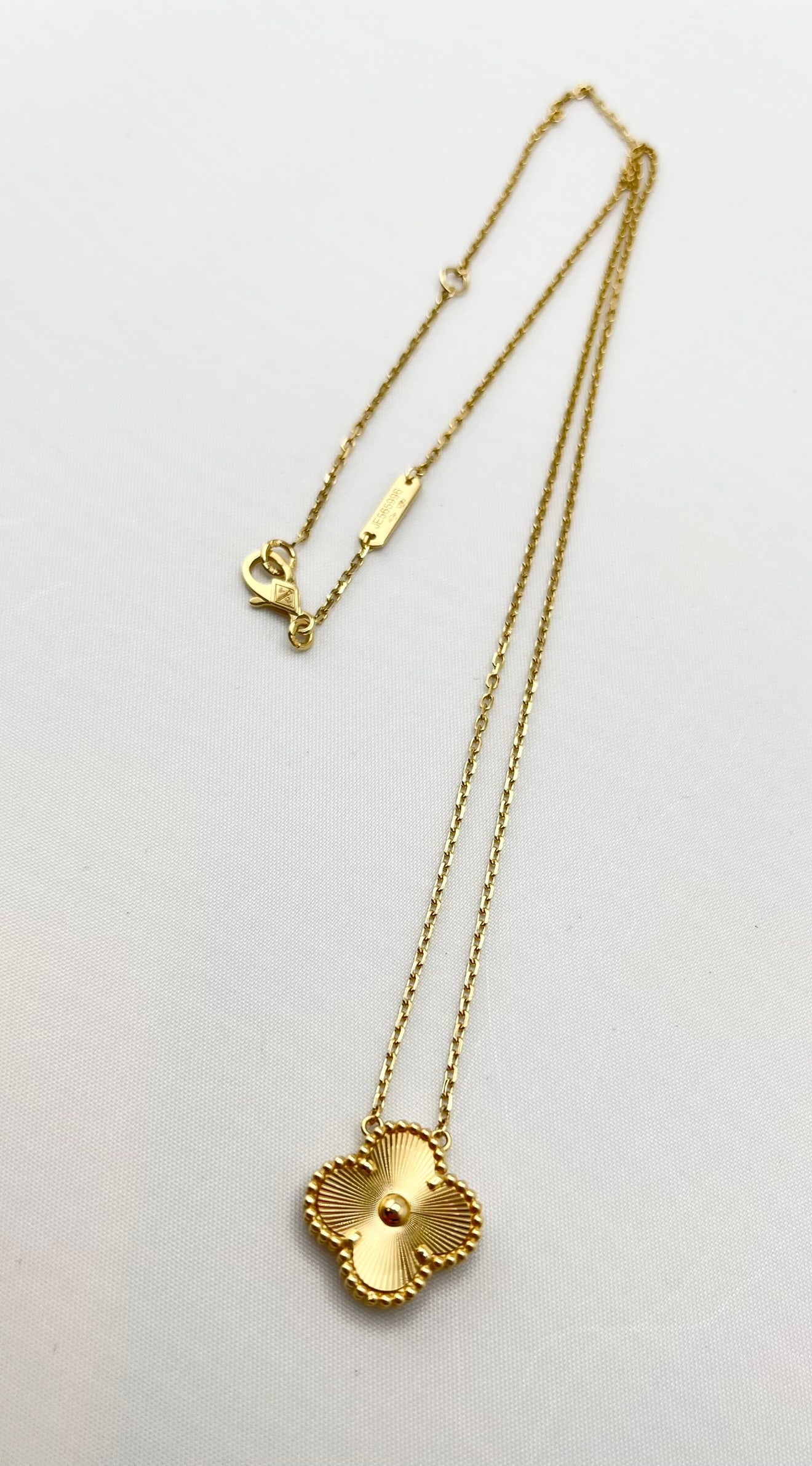 18KT Yellow Gold Hand Crafted Guilloche Pattern Single Clover Pendant Necklace: 18KT Yellow Gold Handcrafted Guilloche Pattern Single Pendant Necklace. 18 inches. 5.3 grams