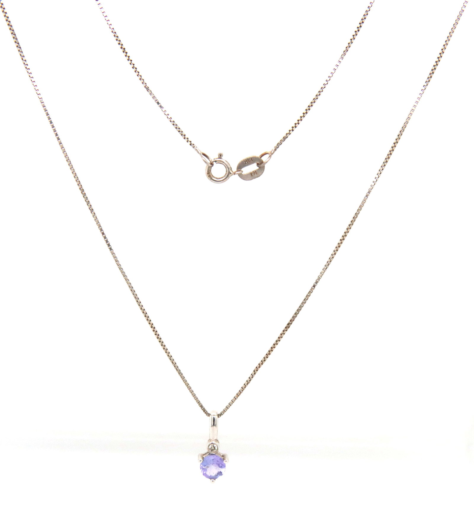 14kt White gold blue topaz pendant on box chain necklace: 14kt White gold blue topaz pendant on 18-inch box chain necklace. The total weight of the necklace is 1.4 grams.