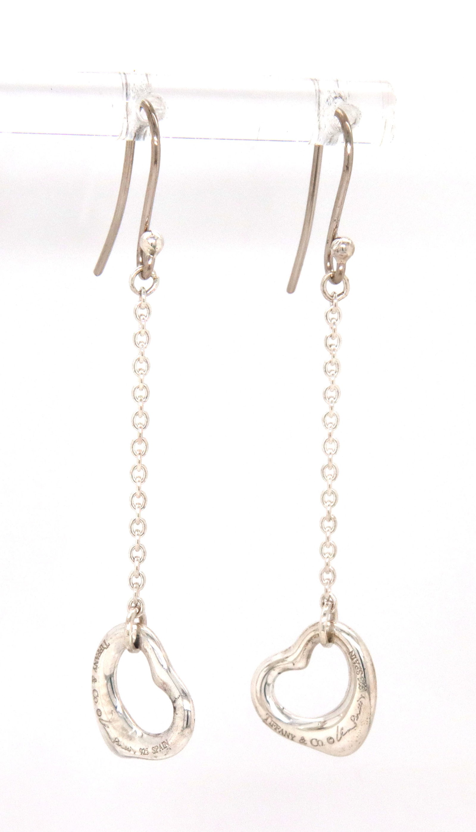 Tiffany & Co open heart dangle earrings: Tiffany & Co open heart dangle earrings in 925 sterling silver. The total weight of the earrings is 2.15 grams.