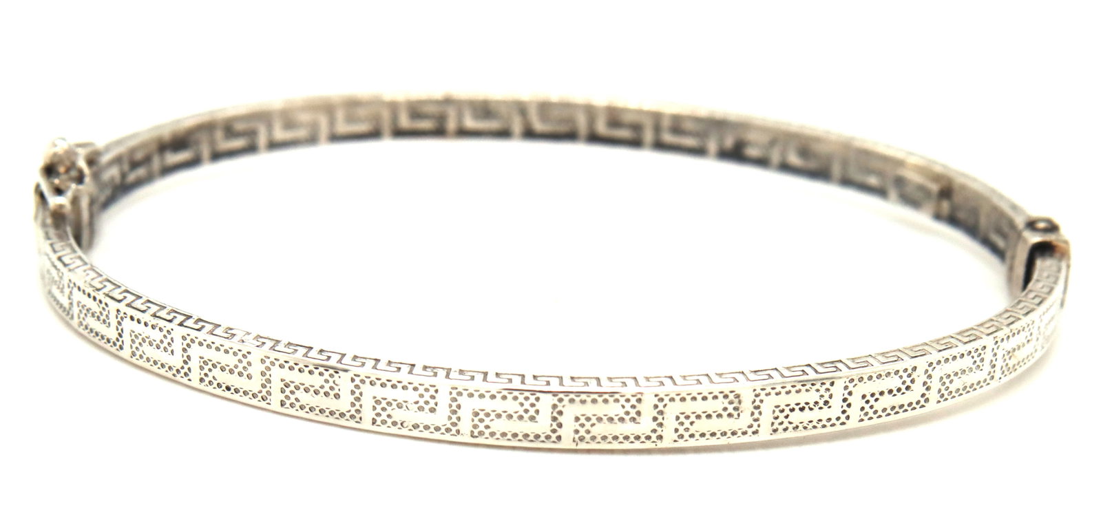 Greek key bangle bracelet in 925 sterling silver: Greek key bangle bracelet in 925 sterling silver. The total weight of the bangle is 6.70 grams.