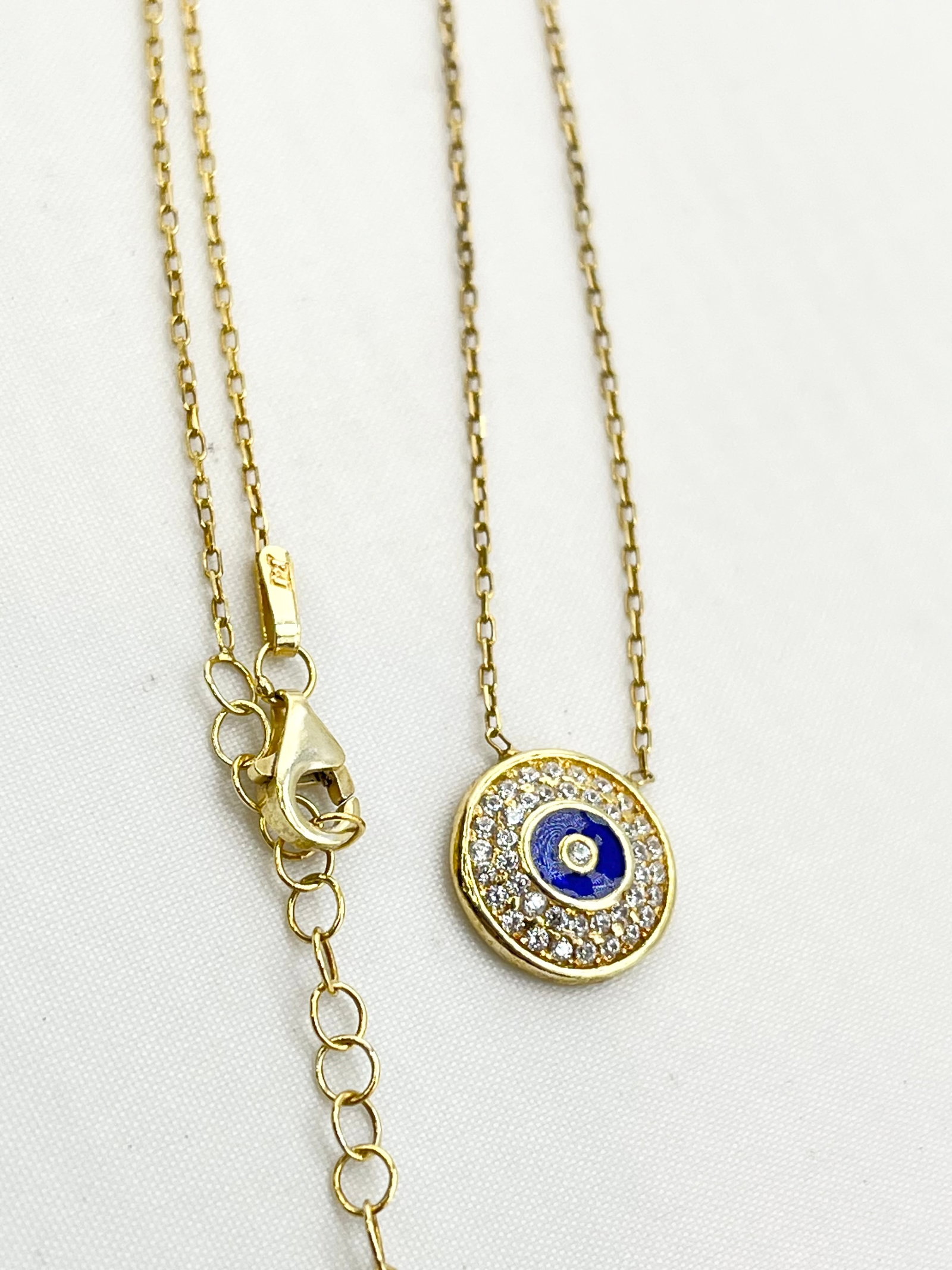 925 Sterling Silver Gold Tone Full Crystal Pave Evil Eye Pendant Necklace: 925 sterling silver gold tone full pave crystal round blue evil eye necklace. 2.3 grams. 18 inches