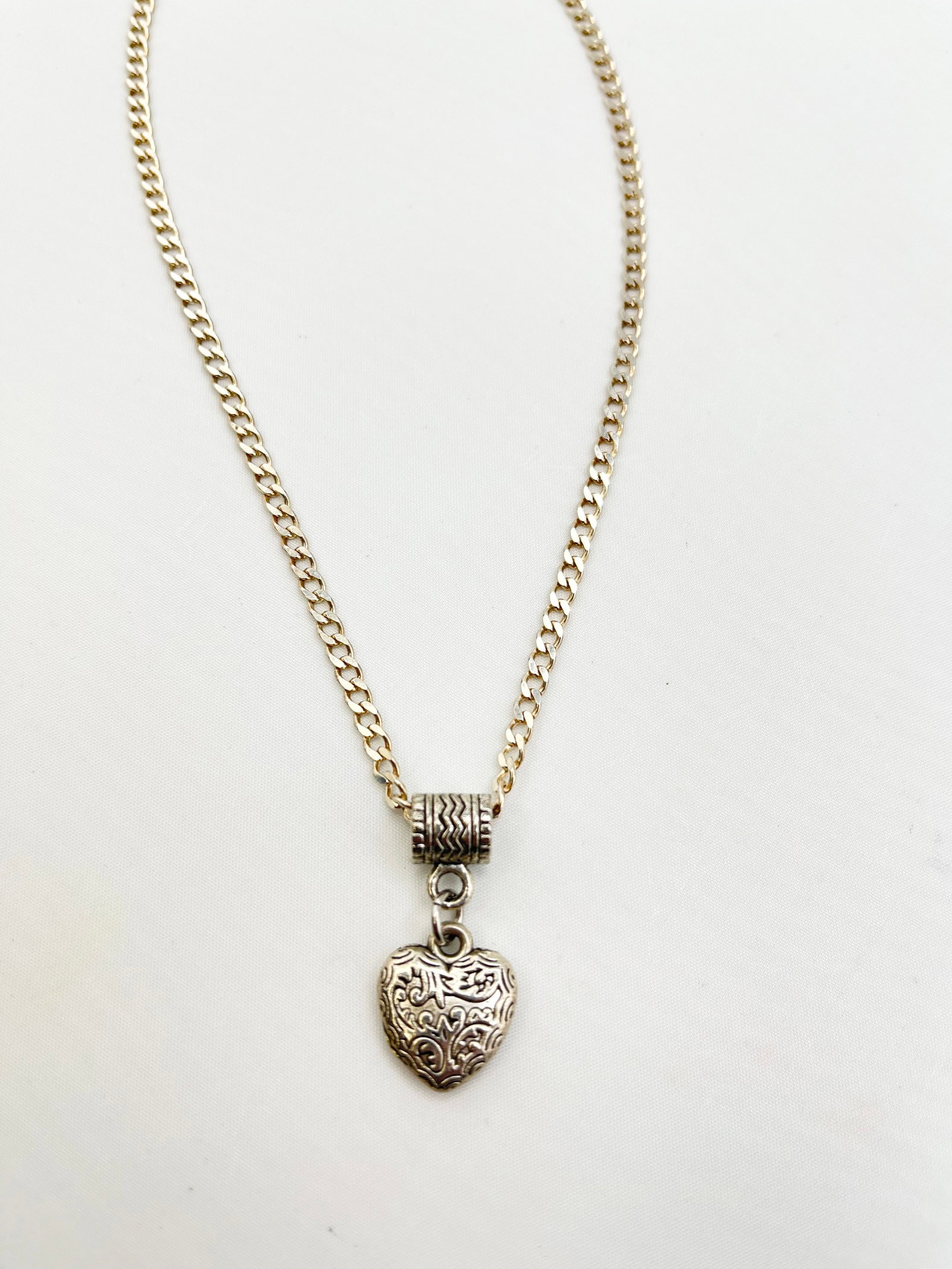 925 Sterling Silver Scrolled Or Filigree Design Heart With Long Curb Link Chain Necklace: 925 Sterling Silver Scrolled or Filigree design Heart Pendant With Italian Curb Link Chain. 12.5 Grams . The chain is 20 inches