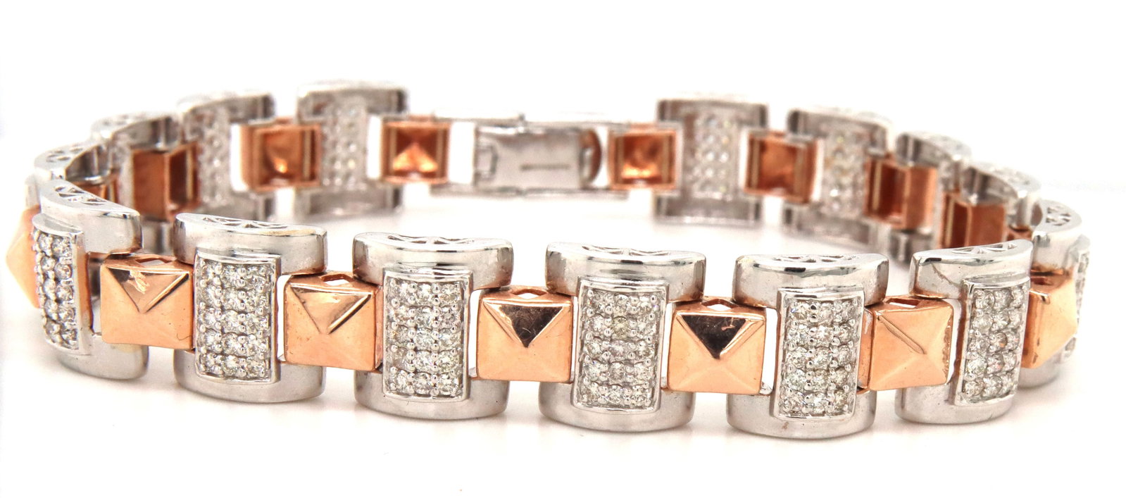 14kt White and rose gold diamond bracelet: 14kt White and rose gold diamond 8-inch bracelet. The total weight of the bracelet is 27.2 grams.