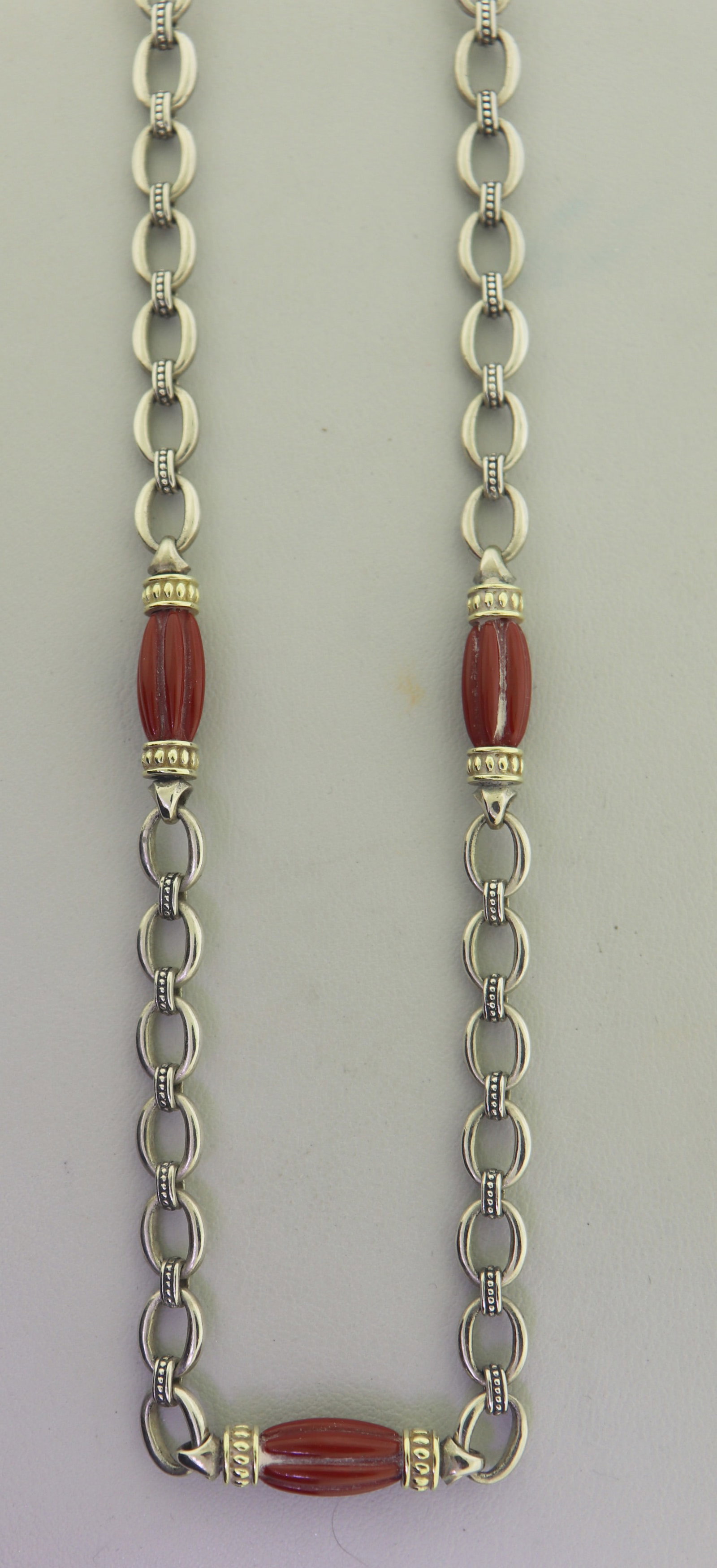 Lagos Caviar Signature Beaded Necklace: Vintage 18KT Gold and 925 sterling Silver Lagos Caviar signature? Mediterranean Coral with oval and beaded links necklace finished with lobster clasp. 42 grams.
