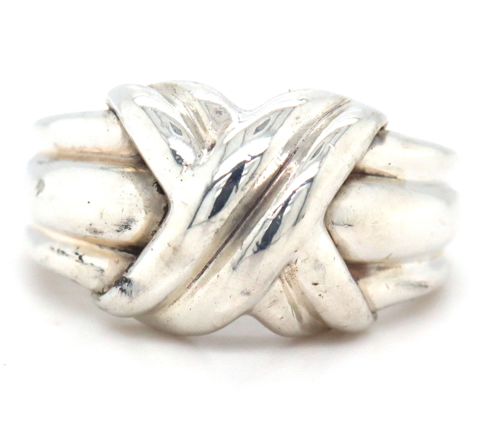 Tiffany & Co Vintage signature X ring: Tiffany & Co Vintage signature X ring in 925 sterling silver. The total weight of the ring is 6.60 grams. Ring size 8".