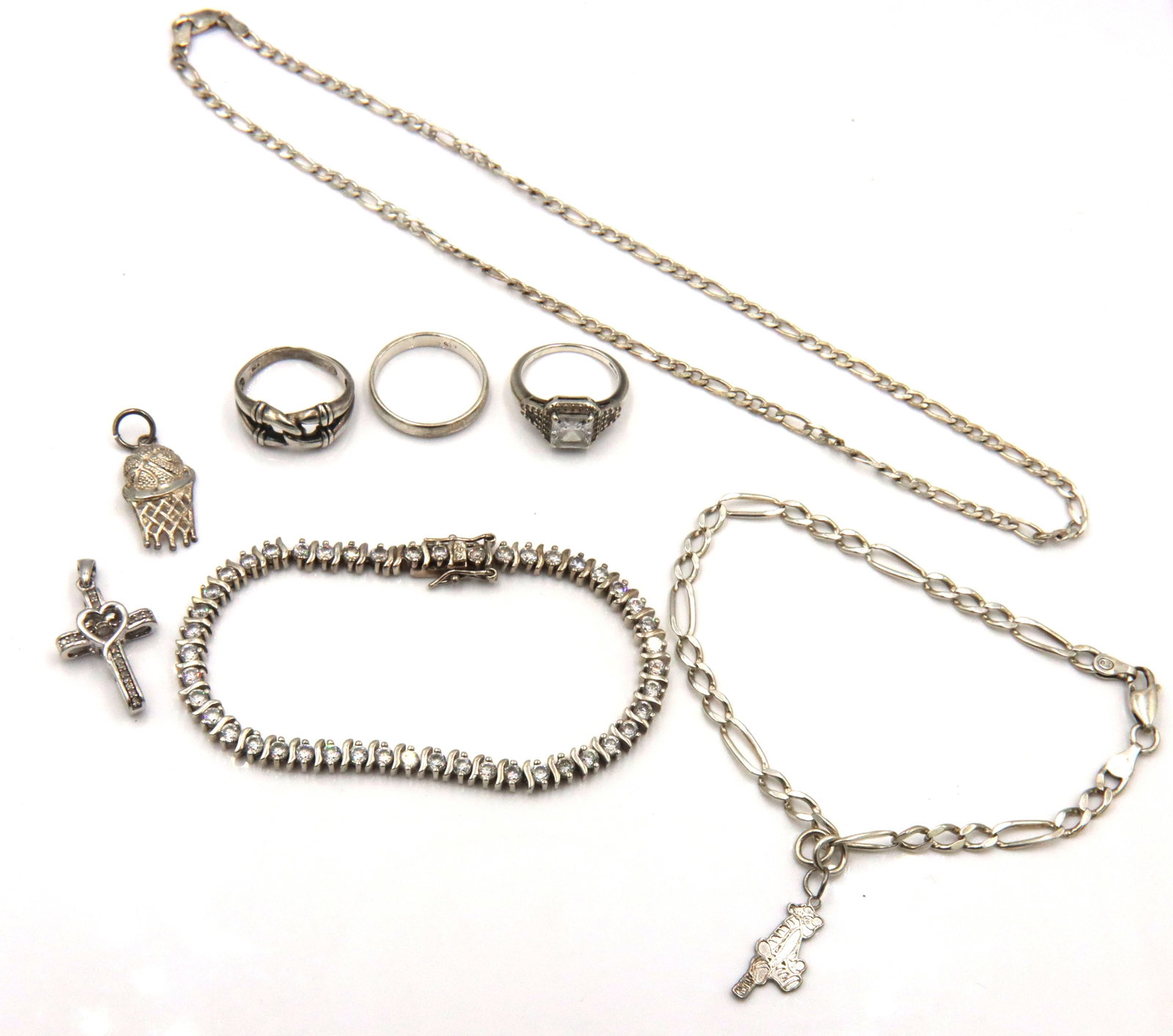 Group lot of Vintage 925 sterling silver mixed jewelry: Group lot of Vintage 925 sterling silver mixed jewelry. 8-inch Figaro bracelet with charm. 16-inch Figaro chain necklace, 8-inch cubic zirconia link bracelet. 2 pendants and 3 rings. Ring size 6".6.5"