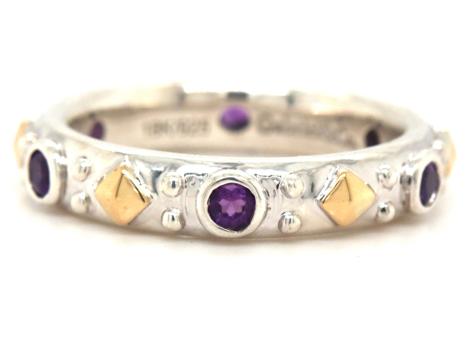 Gabriel & Co two tone bezel set amethyst stackable band: Gabriel & Co two tone bezel set amethyst stackable band in 925 sterling silver. The total weight of the ring is 5.40 grams. Ring size 7.25".