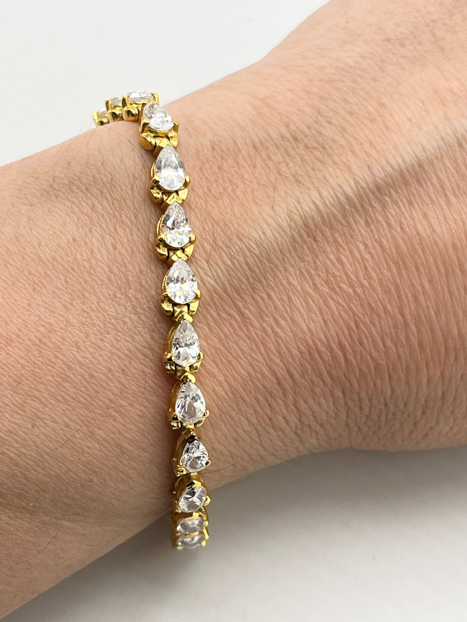 925 Gold Tone Sterling Silver Pear Shaped CZ Tennis Bracelet: 925 Gold Tone Sterling Silver Pear-Shaped CZ Tennis Bracelet. 15Grams. 7.5 Inches