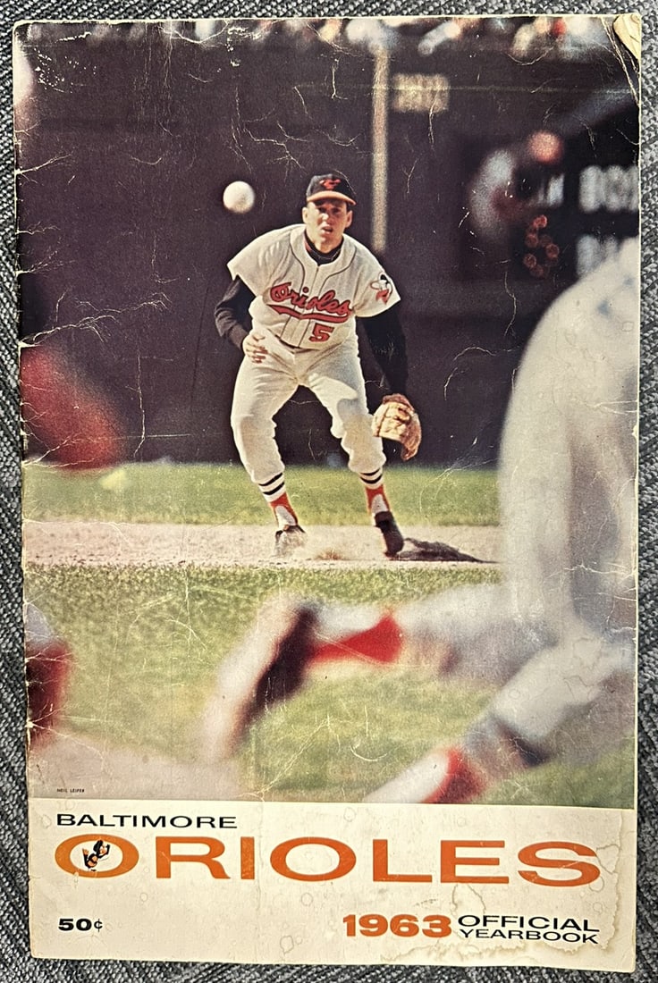 1963 Baltimore Orioles Official Yearbook & Memorial Stadium Souvenir Program Lot: Vintage lot featuring a 1963 Baltimore Orioles Official Yearbook, along with a Memorial Stadium souvenir/program booklet highlighting Major League Baseball in Baltimore. These classic mid-century