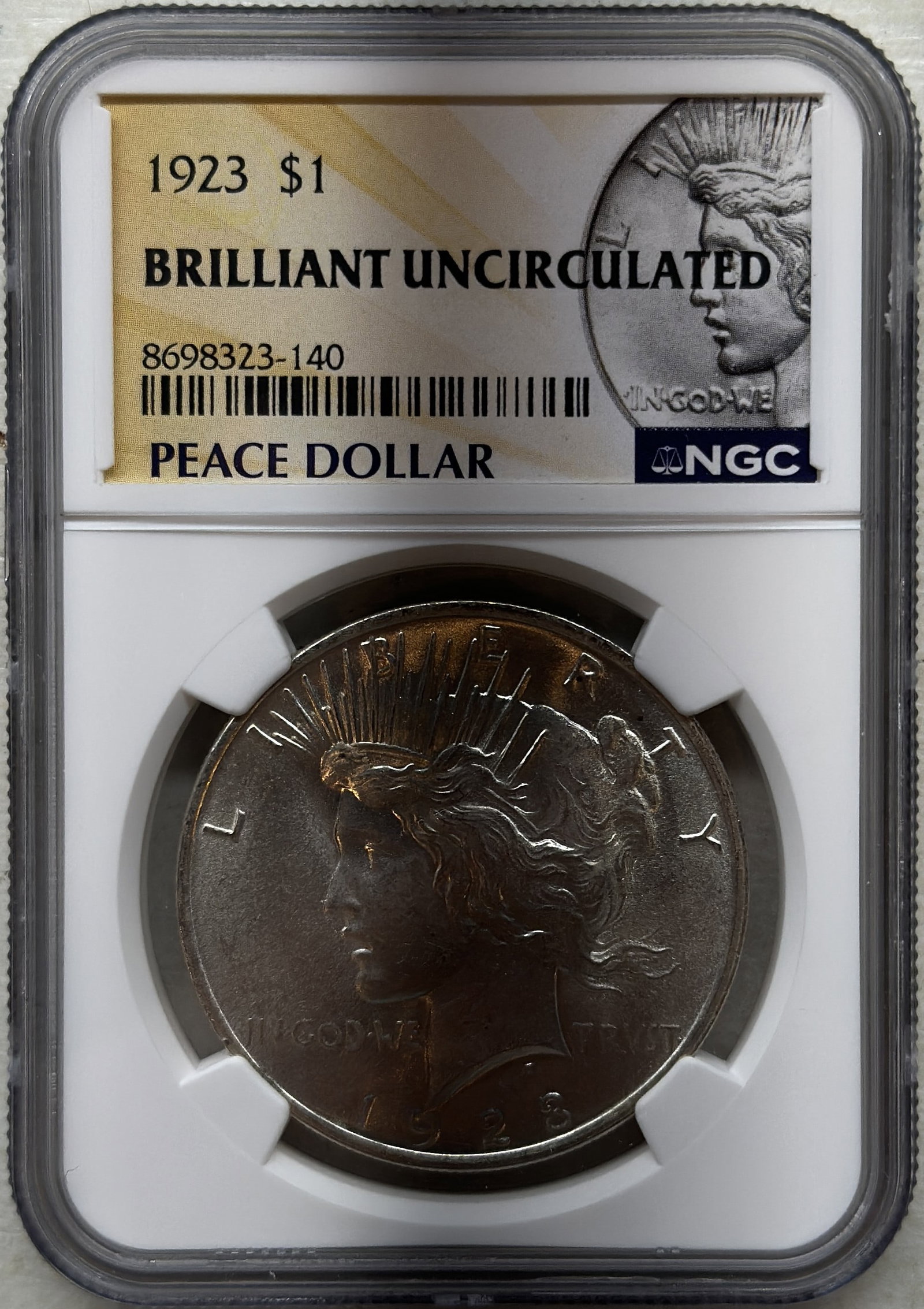 1923 Peace Silver Dollar NGC Brilliant Uncirculated 100th Anniversary Holder: 1923 Peace Silver Dollar certified by NGC as Brilliant Uncirculated and housed in the special 100th Anniversary holder. Celebrate a century of American coinage history with this stunning Struck in 90%