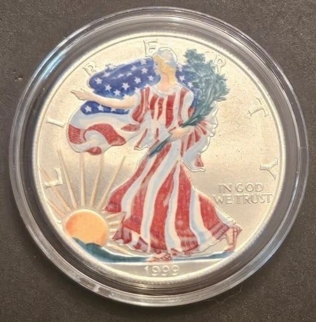 1999 Colorized American Silver Eagle $1 Coin with Box and COA 1 oz .999 Fine Silver: 1999 American Silver Eagle Dollar featuring the iconic Walking Liberty design enhanced with vibrant patriotic red, white, and blue coloration. Because apparently, even one of the most recognizable sil
