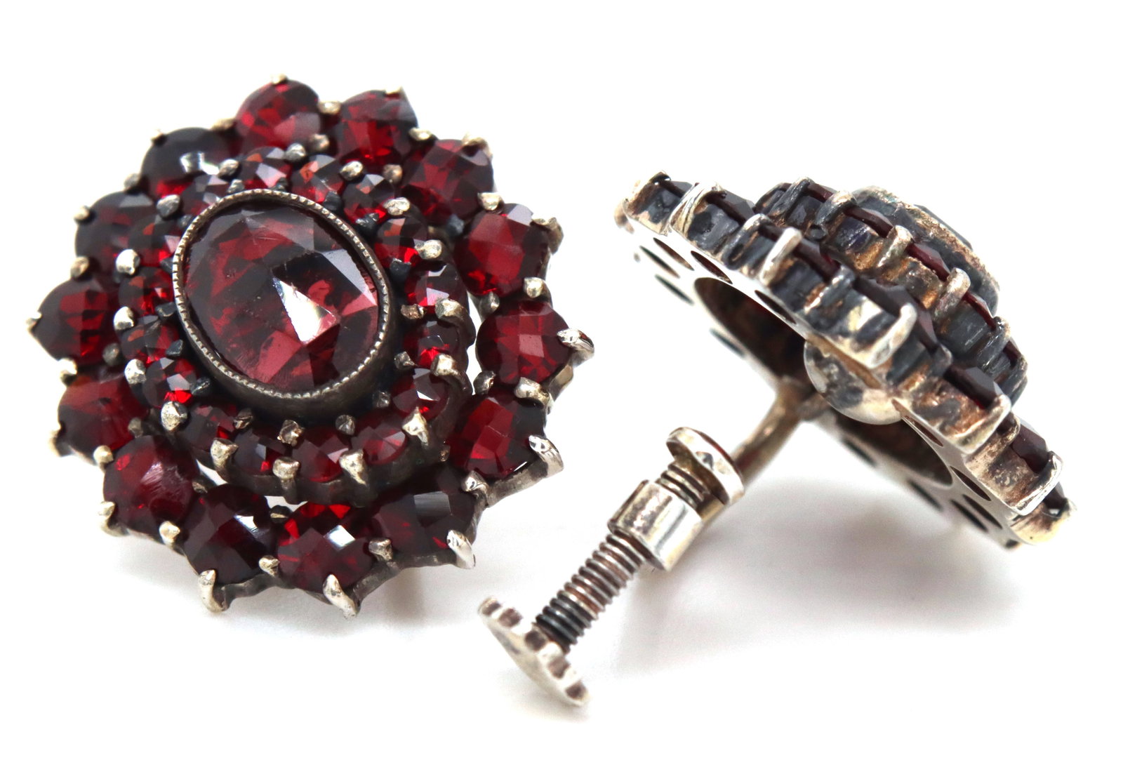 Antique Garnet cluster earrings in 925 sterling silver: Antique Garnet cluster earrings in 925 sterling silver. The total weight of the earrings is 8.05 grams.