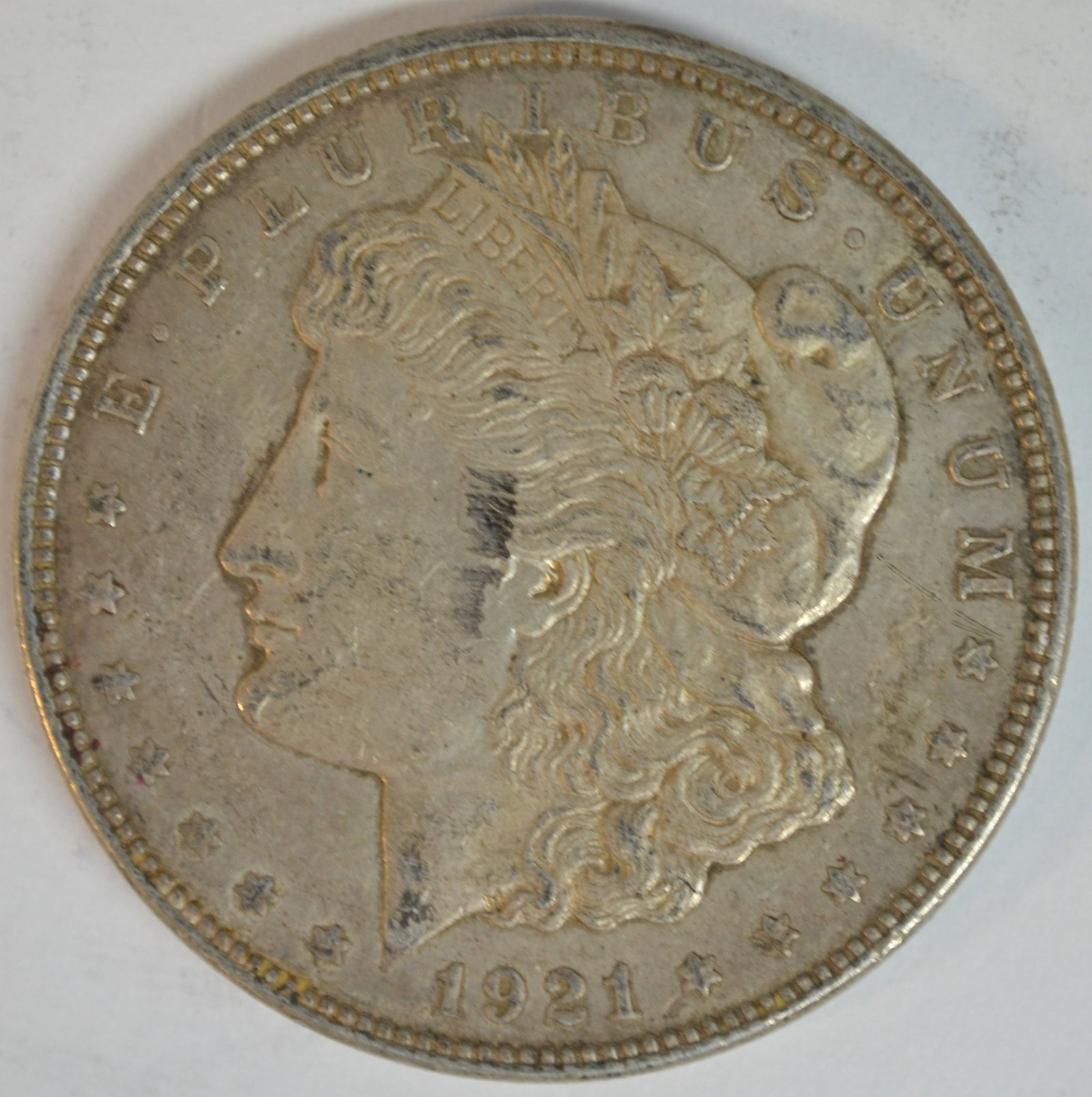 1921 Morgan Silver Dollar Philadelphia Mint Better Circulated Example: 1921 Morgan Silver Dollar, the final year of issue for the famous Morgan Dollar series. Struck in 90% silver at the Philadelphia Mint (no mint mark), this iconic American coin features Liberty on the 