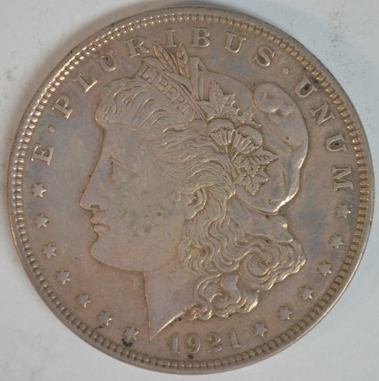 1921 Morgan Silver Dollar Philadelphia Mint Better Circulated Example 90% Silver: 1921 Morgan Silver Dollar, the final year of the iconic Morgan Dollar series designed by George T. Morgan. Struck in 90% silver at the Philadelphia Mint (no mintmark), this historic coin represents th