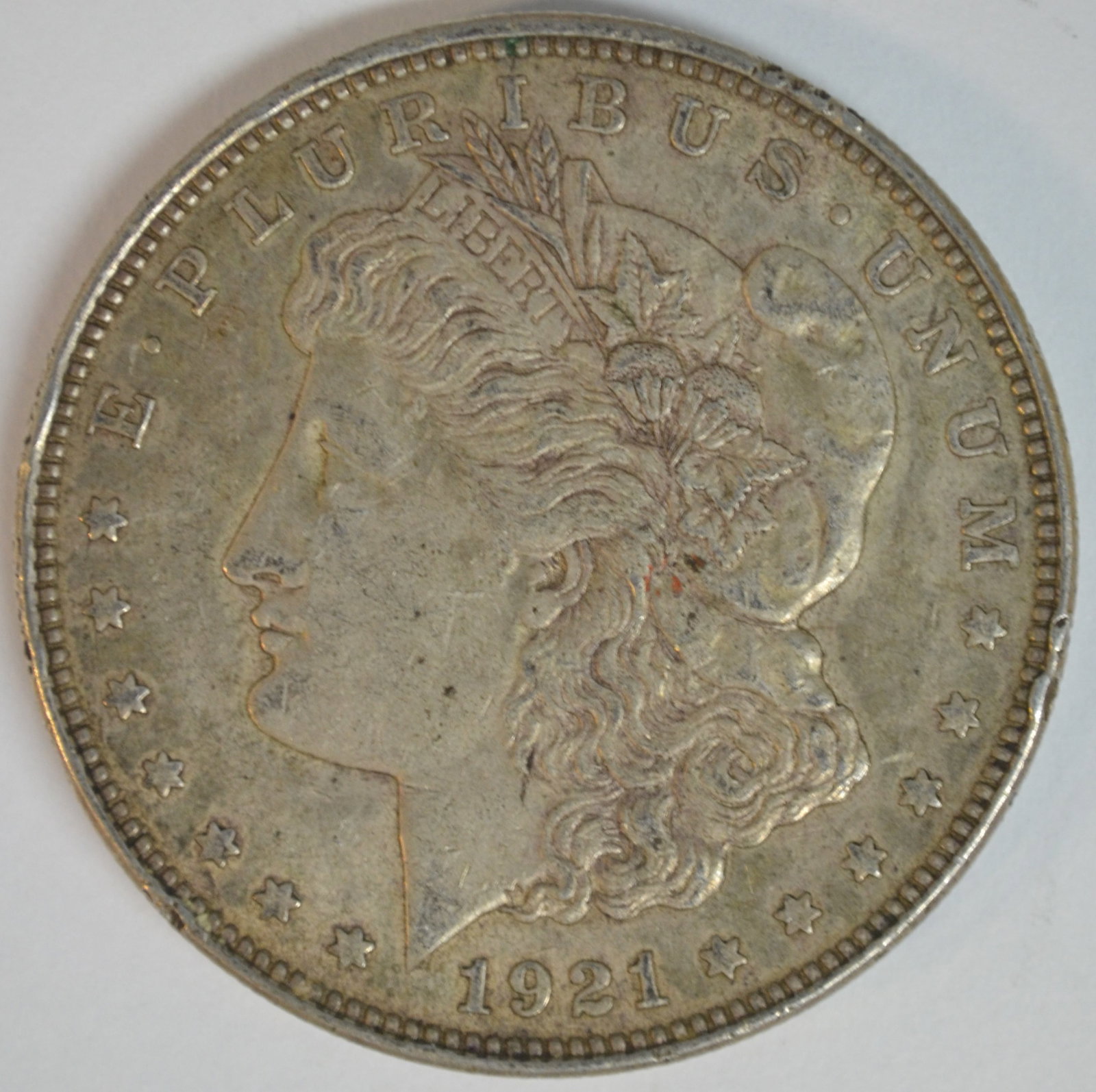 1921 Morgan Silver Dollar Philadelphia Mint Better Circulated Example: 1921 Morgan Silver Dollar, the final year of the iconic Morgan Dollar series before the introduction of the Peace Dollar later that same year. Struck in 90% silver, this classic American coin remains 