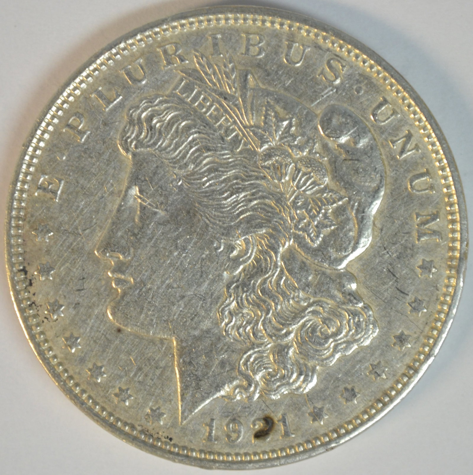 1921-D Morgan Silver Dollar Denver Mint Circulated Silver Dollar: 1921-D Morgan Silver Dollar, struck at the Denver Mint during the final year of Morgan Dollar production. The 1921 issue marks a historic conclusion to one of America's most beloved coin series and