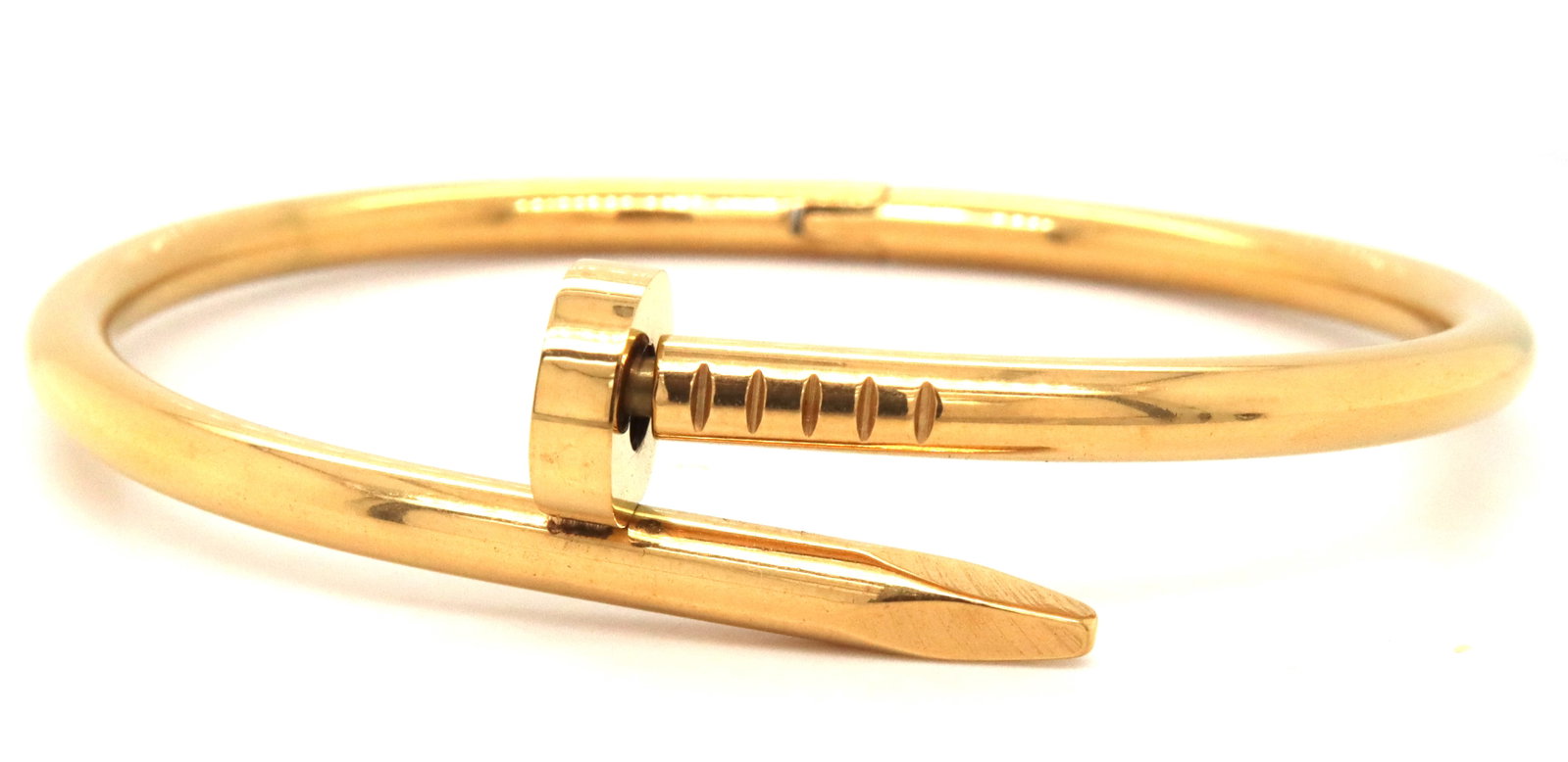 Gold Plated nail bangle bracelet: Gold Plated nail bangle bracelet. The total weight of the bangle is 21.1 grams. 7.25-inches.