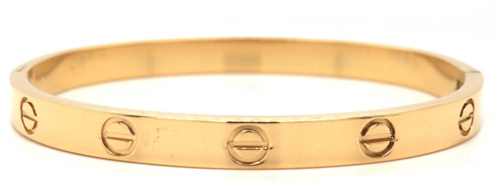 Gold plated bangle bracelet: Gold plated bangle bracelet. 7-inches. The total weight of the bangle is 20.5 grams. Note: NOT a designer piece.