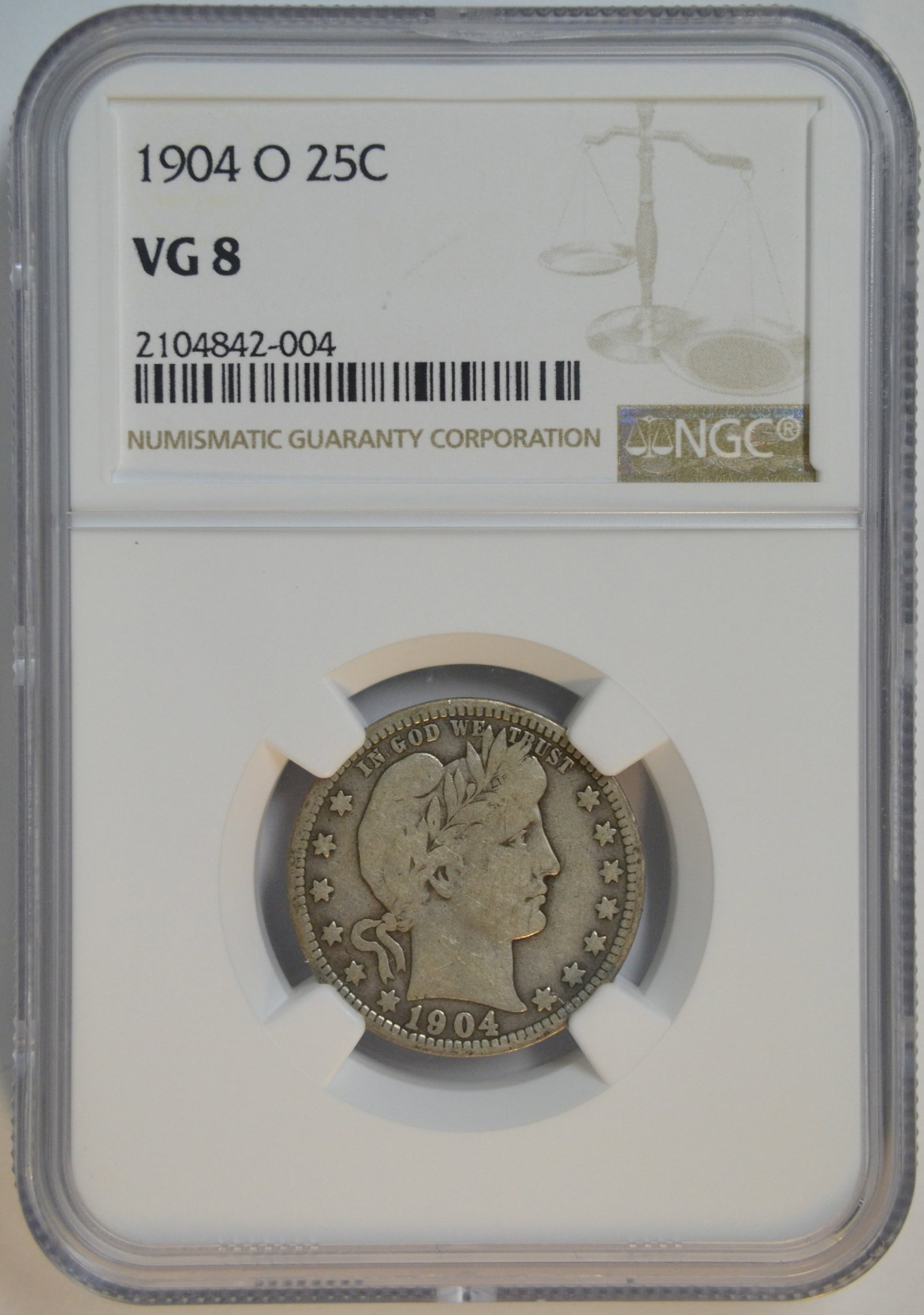1904-O Barber Quarter 25C NGC VG-8 Certified New Orleans Mint Silver Quarter: 1904-O Barber Quarter, struck at the New Orleans Mint and certified VG-8 (Very Good 8) by NGC (Numismatic Guaranty Corporation). Designed by Charles E. Barber, this classic silver quarter is a