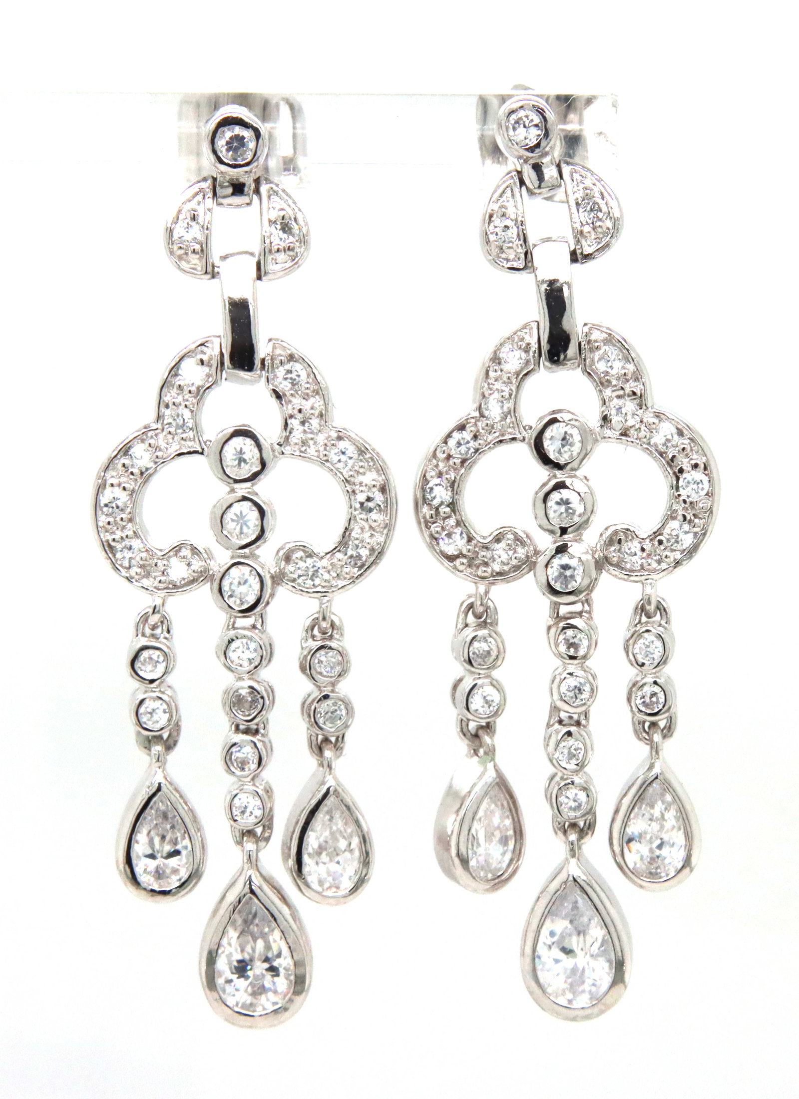925 Sterling silver cubic zirconia dangle earrings: 925 Sterling silver cubic zirconia dangle earrings. The total weight of the earrings is 8.72 grams.