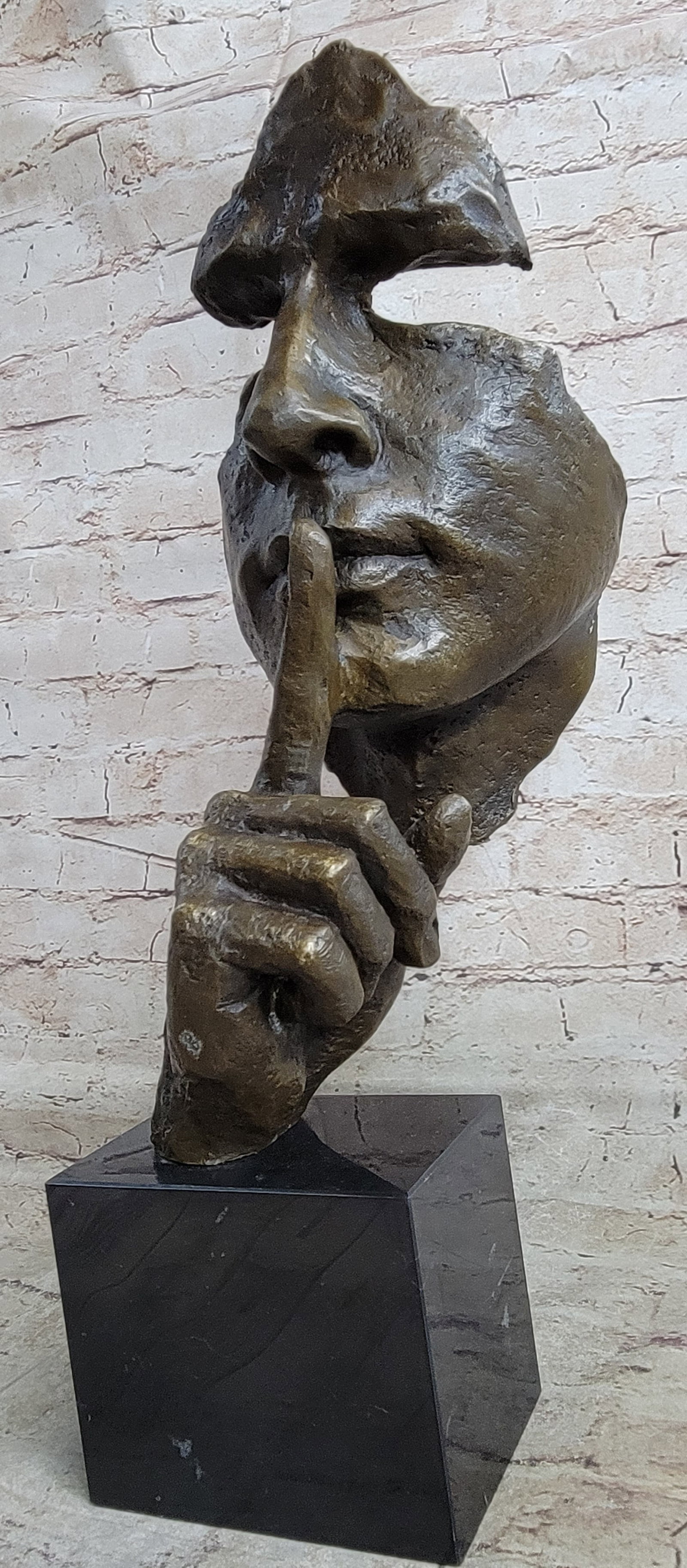 Man Hush Up Bronze Sculpture: The modern art Sculpture with the title Silence is an abstract figure that was created as an homage to the great artist Salvador Dali, the amazing Surrealism artist. Silence is a simple designed
