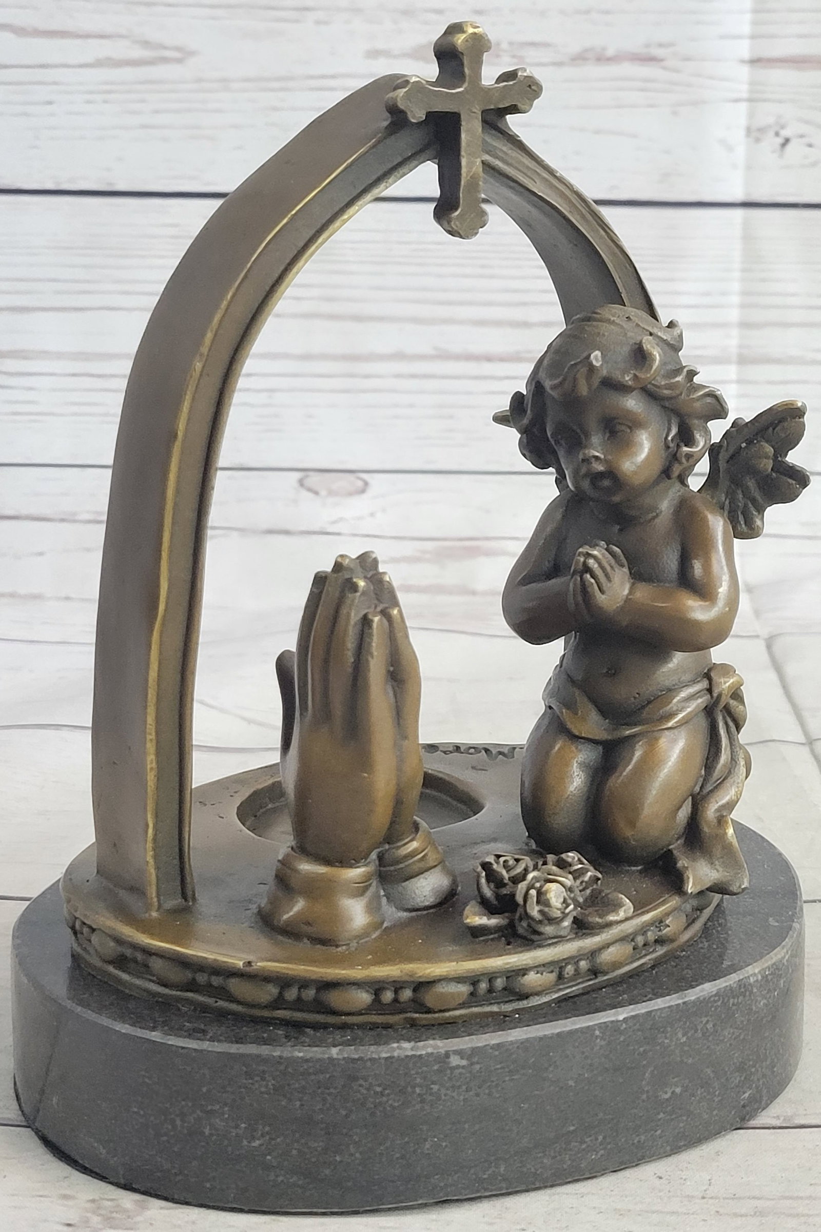 Praying Baby Angel Bronze Sculpture: The Praying Angel Bronze Statues are made from solid and the finest bronze available. The bronze statues are manufactured in Spain by some of the finest bronze experts in the world. All of our bronze 