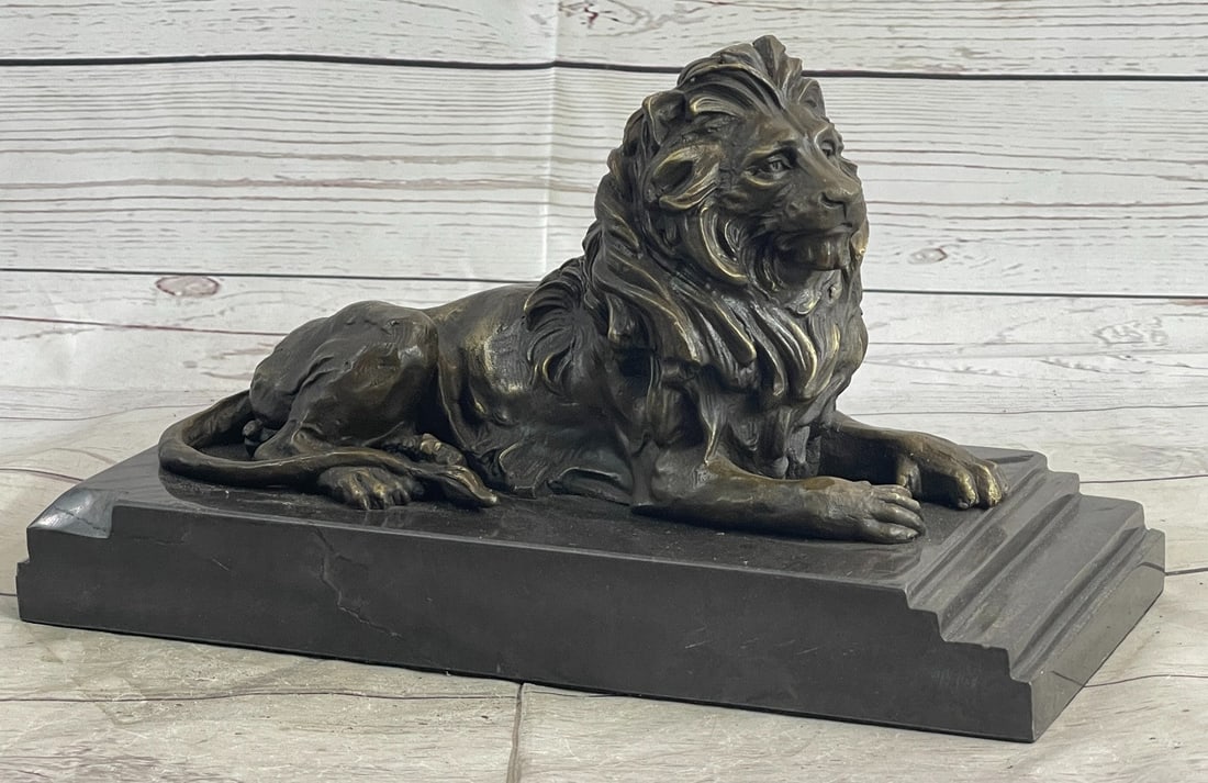 African Lion Wild Life Animal Edition Bronze Sculpture: Hes angry, hungry, and unrelenting. The lions paws grip the ground, the tension spreads like a current from his paws to all the tendons in his body. His mouth is open wide in what can only be a feroci