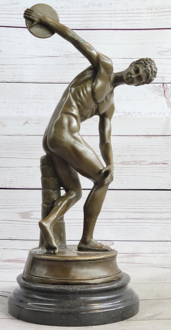 Discus Thrower Bronze Sculpture: This is a bronze replica of The Discobolus of Myron which is a famous Greek sculpture that was completed towards the end of the Severe period, circa 460-450 BC. The original Greek bronze is lost. It