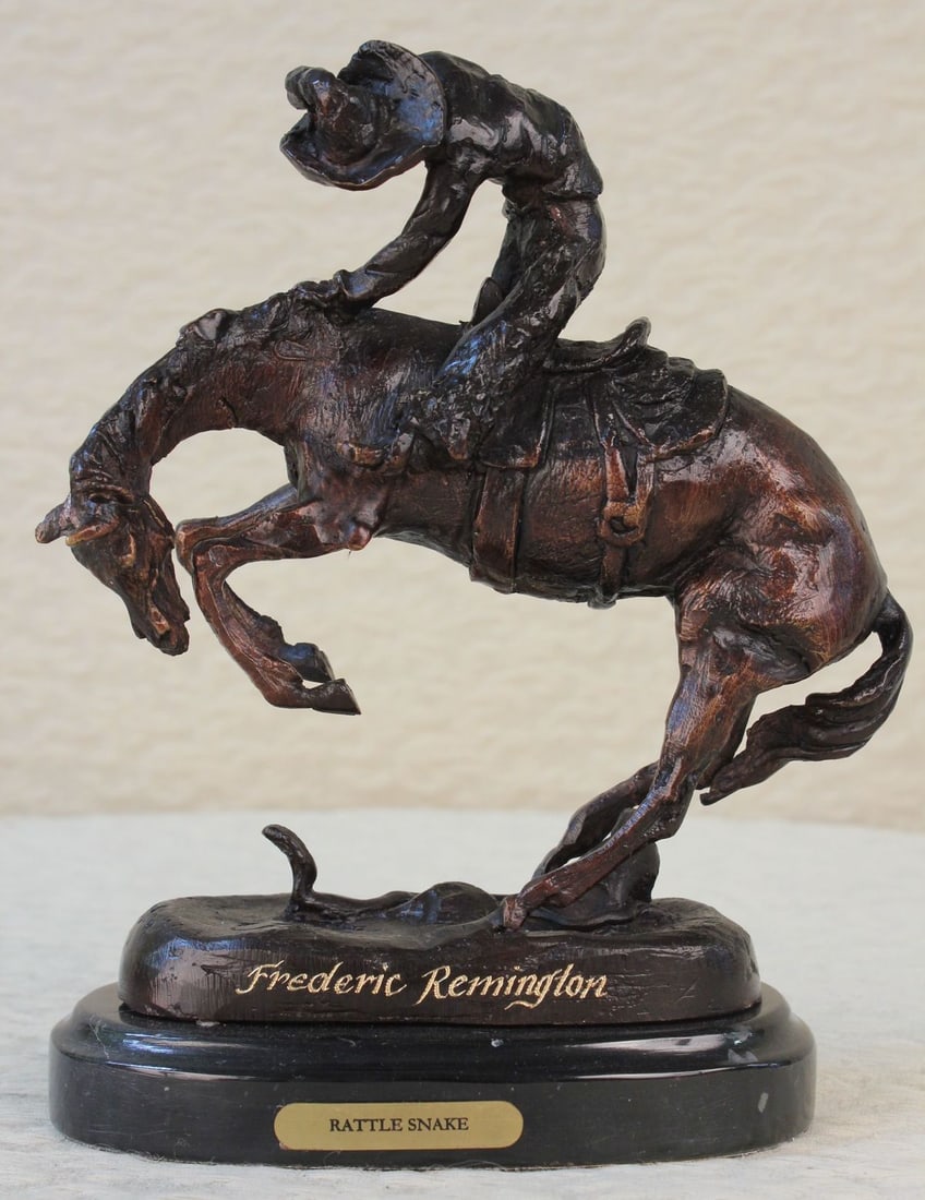 Batteling a Rattle and Snake Bronze Statue: A leisurely trot in the desert turns deadly when a rattlesnake spooks a horse. The cowboy is bucked by his uncontrollable stallion. He attempts to hold on as long as he can but his body lifts from