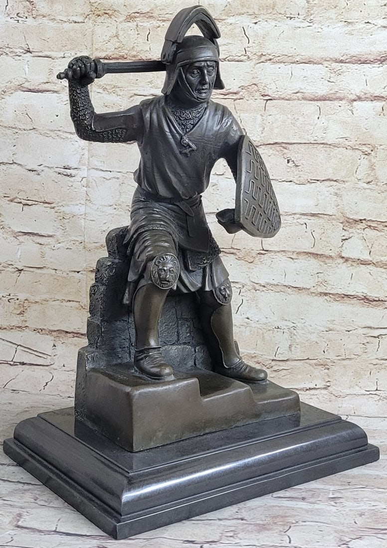 Japanese samurai Warrior Bronze Sculpture: This Japanese Samurai Warrior stands in a fighting pose ready to attack whoever comes close. He protects himself with his shield and his sword, as he stands on top of some stoops he does not show any 