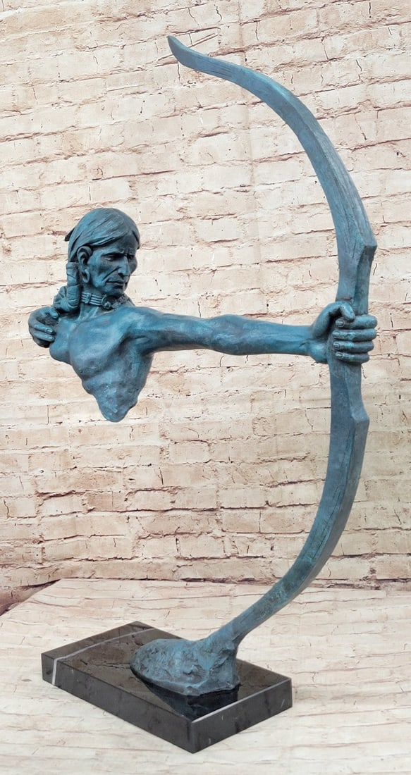 Indian Bronze Bust Sculptur: The Native American warrior is seen from his right side. His eyes focus on the travel of his arrow just shot like a hawk it is prey and his hand pulled back from the release, is attached to his chest.