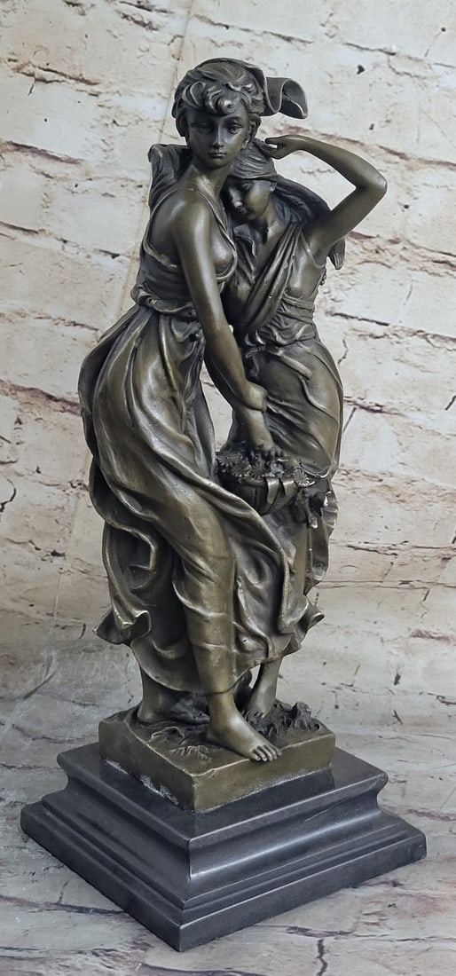Bronze Figural Group Consolation Two Girls with Floral Basket, Lost Wax Cast, Marble Base: A finely cast bronze figural group titled ?Consolation,? depicting two young girls in flowing dresses standing together in a tender and expressive composition. One girl gently holds the arm of the