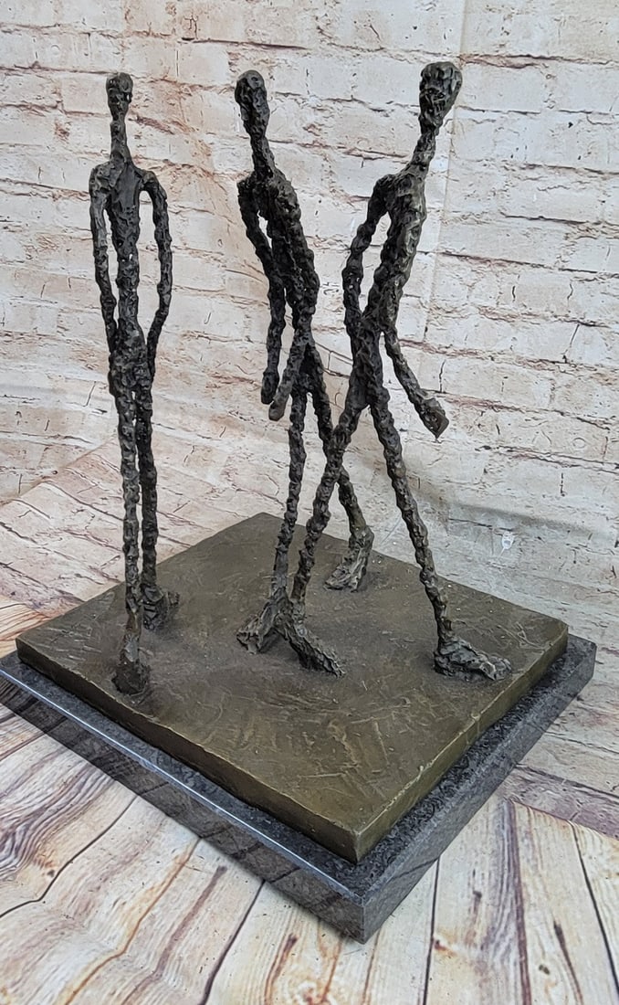 Three Walking Man Bronze Sculpture: Their steps are equally wide, and they do not look at one another. This Bronze Sculpture will go beautifully put in any room of the house or as a gift. The quality of this refined art is rarely found 