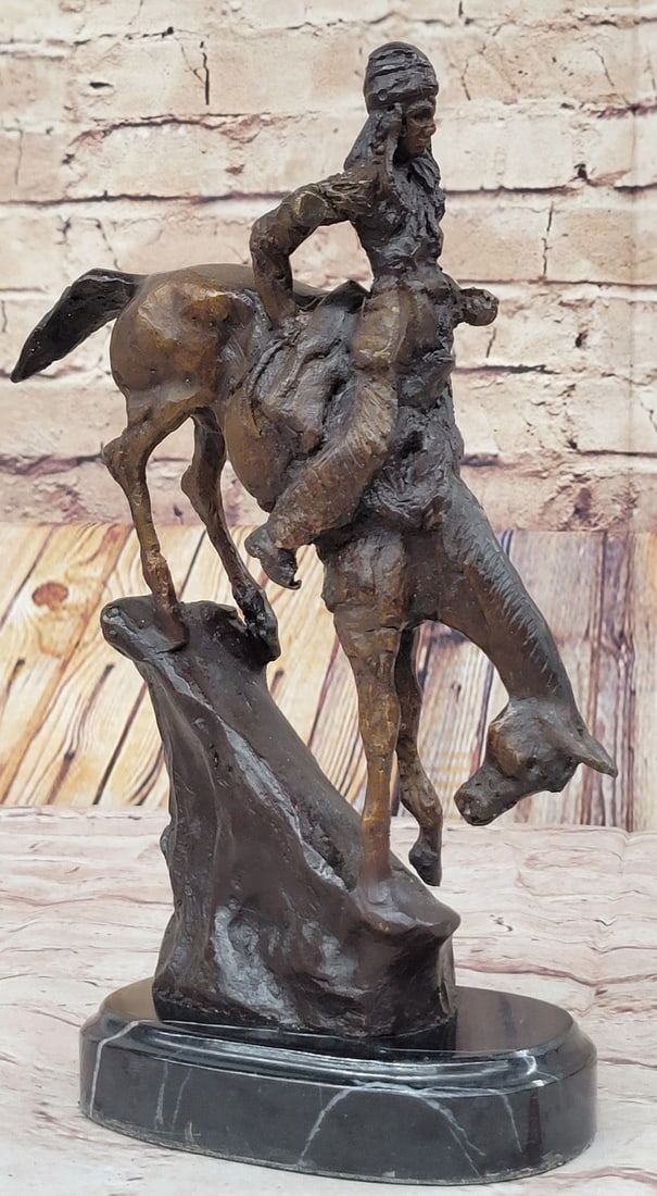 Chief Riding Horse on a Rock Bronze Sculpture: Proud, resilient, strong, and fierce warrior, this Native American watches over his land and tribe. Great attention to detail was paid to his clothing. Most Indian men did not use shirts, but he wears