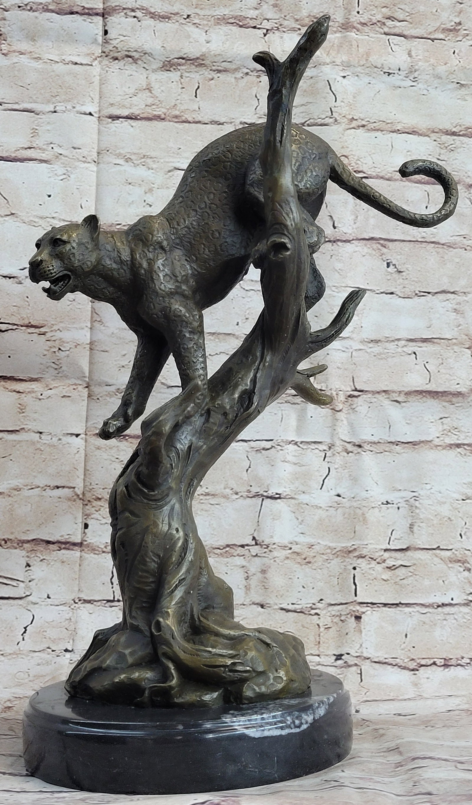 African Mountain Lion Bronze Sculpture: The mountain lion is a beautiful and graceful animal. All their movements almost seem calculated and predetermined so that they never falter and their paws never miss a step. In the rare instance that