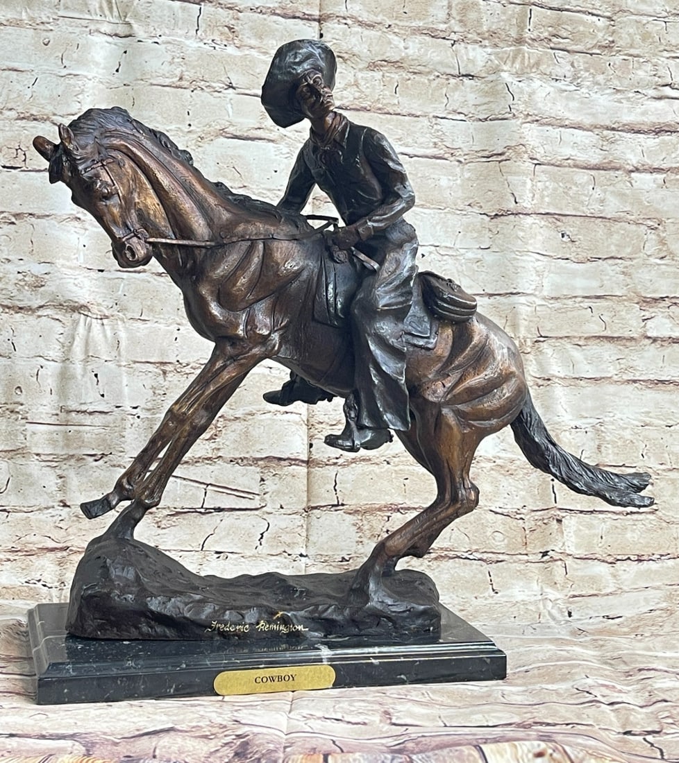 Cowboy Bronze Sculpture: A seasoned cowboy is casually patrolling the area when suddenly something catches his attention. He pulls down on his reins and brings the horse about. His horse head pulls back. He leans forward and 