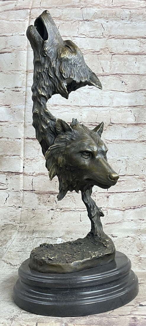 Two Wolves Head Bust Bronze Sculpture: When people think of wolves they think of their lethal hunting skills, howling, and the pack. The creation of a wolf family is unique for animals. Wolves are social predators that live in nuclear fami