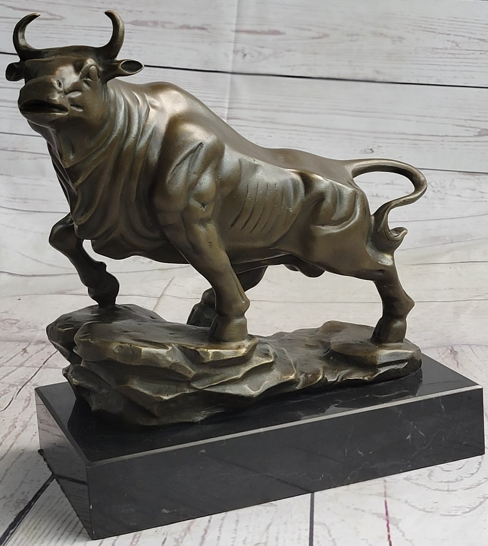 Bull Money wealth Bronze Figure: He starts off in a small trot and slowly begins to gain speed as he runs forward. He is attentive and alert, his horns are sharp and he is ready to charge. His attentive ears and serious facial expres