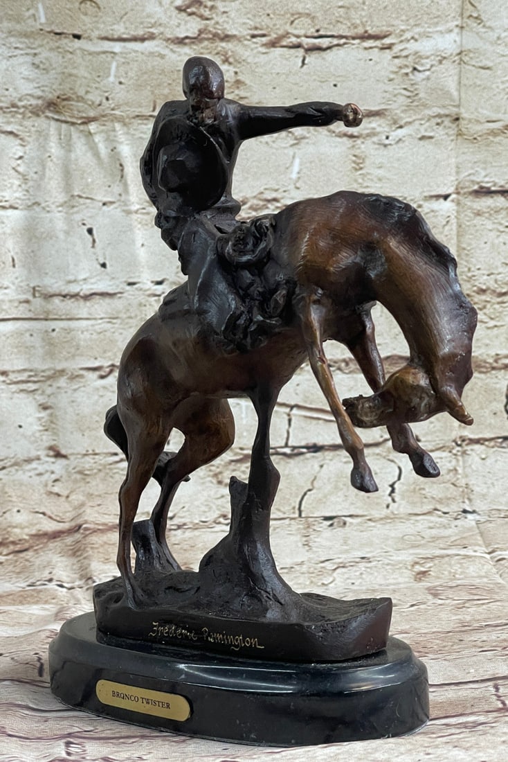 Cowboy With Horse Bronze Sculpture: A seasoned cowboy is casually patrolling the area when suddenly something catches his bronco attention. The horse rears upwards and the cowboy clutches the reins so as not to be bucked. He is dressed 