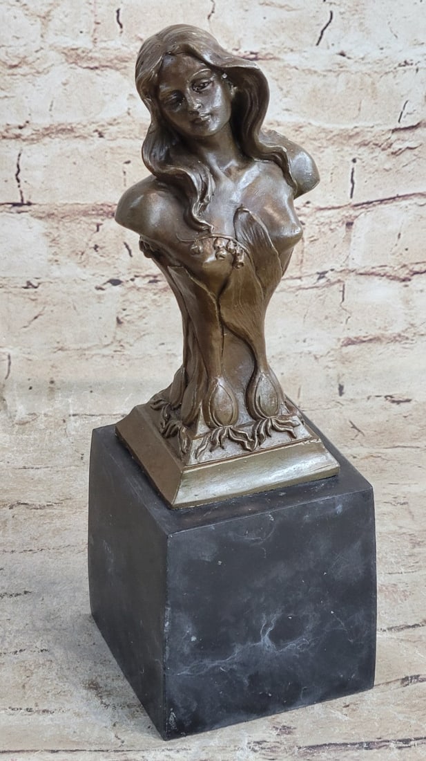 Floreal April Female Bronze Sculpture: She wears an intricately designed flower design over her chest and what could only be a regal gown. The immense details of her beautifully sculpted updo, finely accented by her natural curls add to