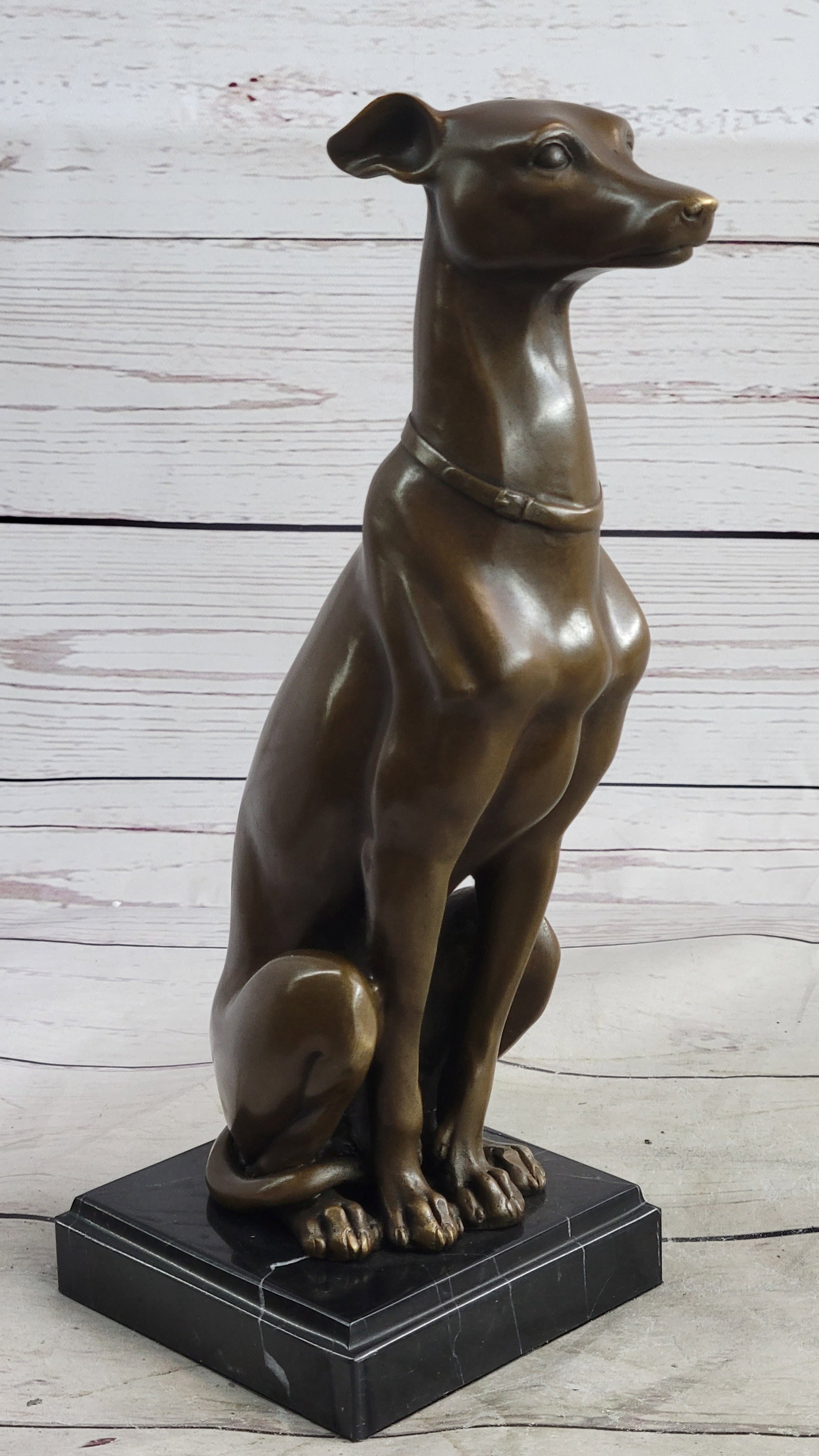 Hound Dog Bronze Sculpture: This sculpture of this beautiful and strong Grey Hound is amazing. This lovely dog sculpture would go perfect in any one house, as a keeper or a gift you must see it face to face. The details on each 