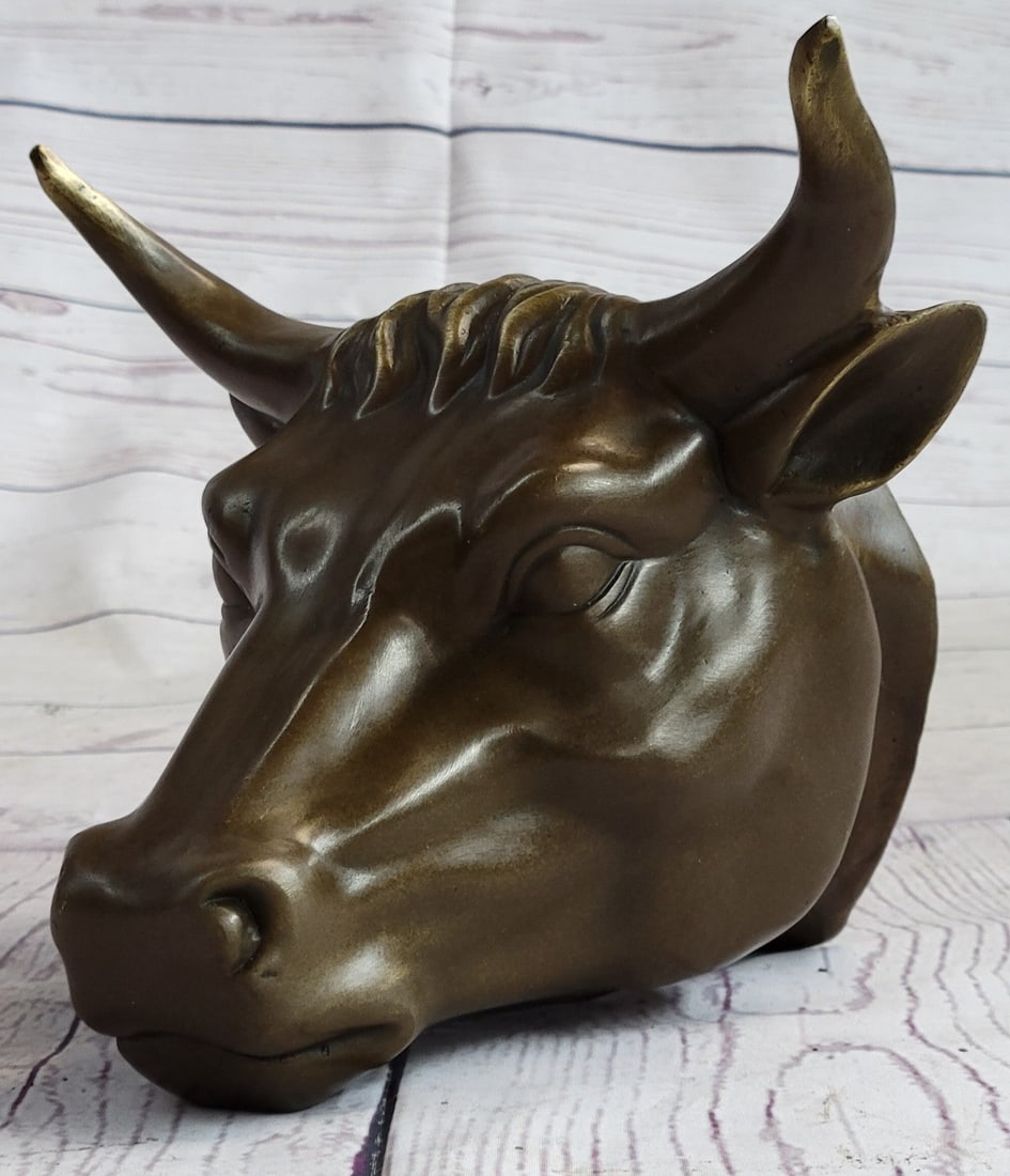 Male Bull Wall Mont Bronze Sculpture: A depiction of the large and mighty Bull Head. The Bull Head Sculpture comes ready to be hung on your wall. The careful and detailed sculpting makes it stunning and easily spotted. It will add a uniqu