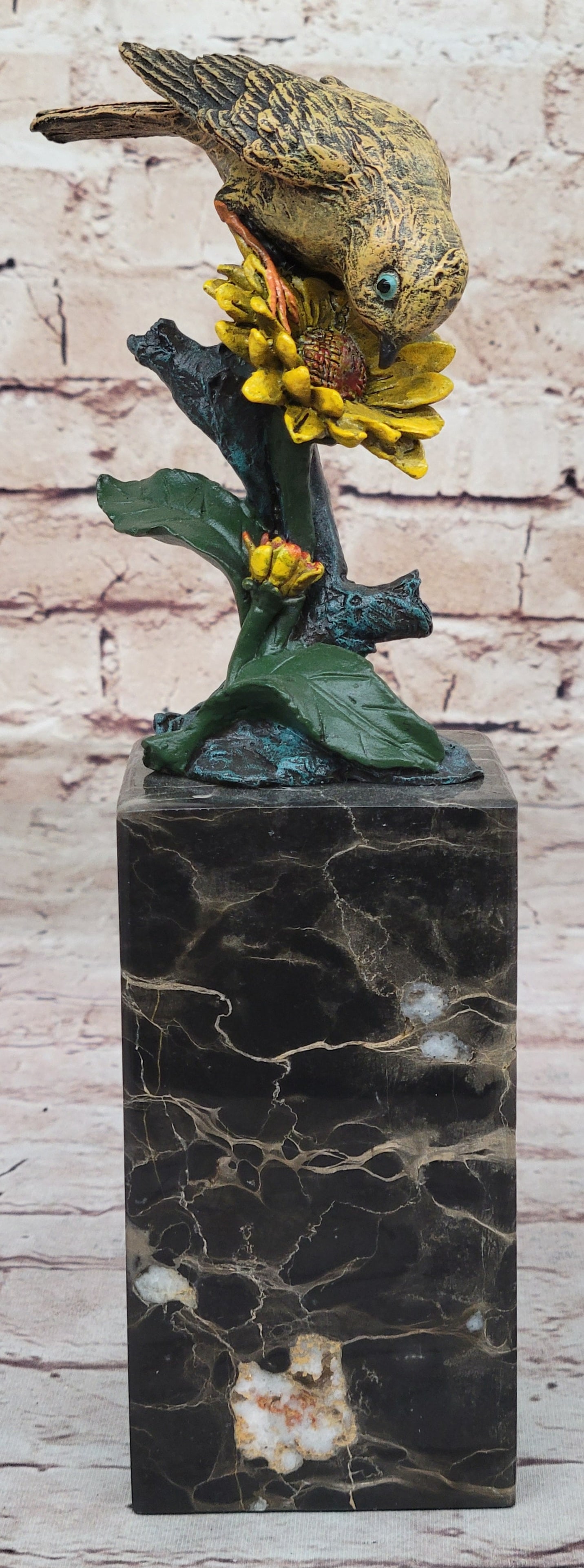 Dove Bronze Figurine: Birds of paradise. Perched on a marble base, the breathtaking multi-color Finches figurines are a testament to nature beauty, featuring wings of vibrantly colored real bronze. It may even be a sweet